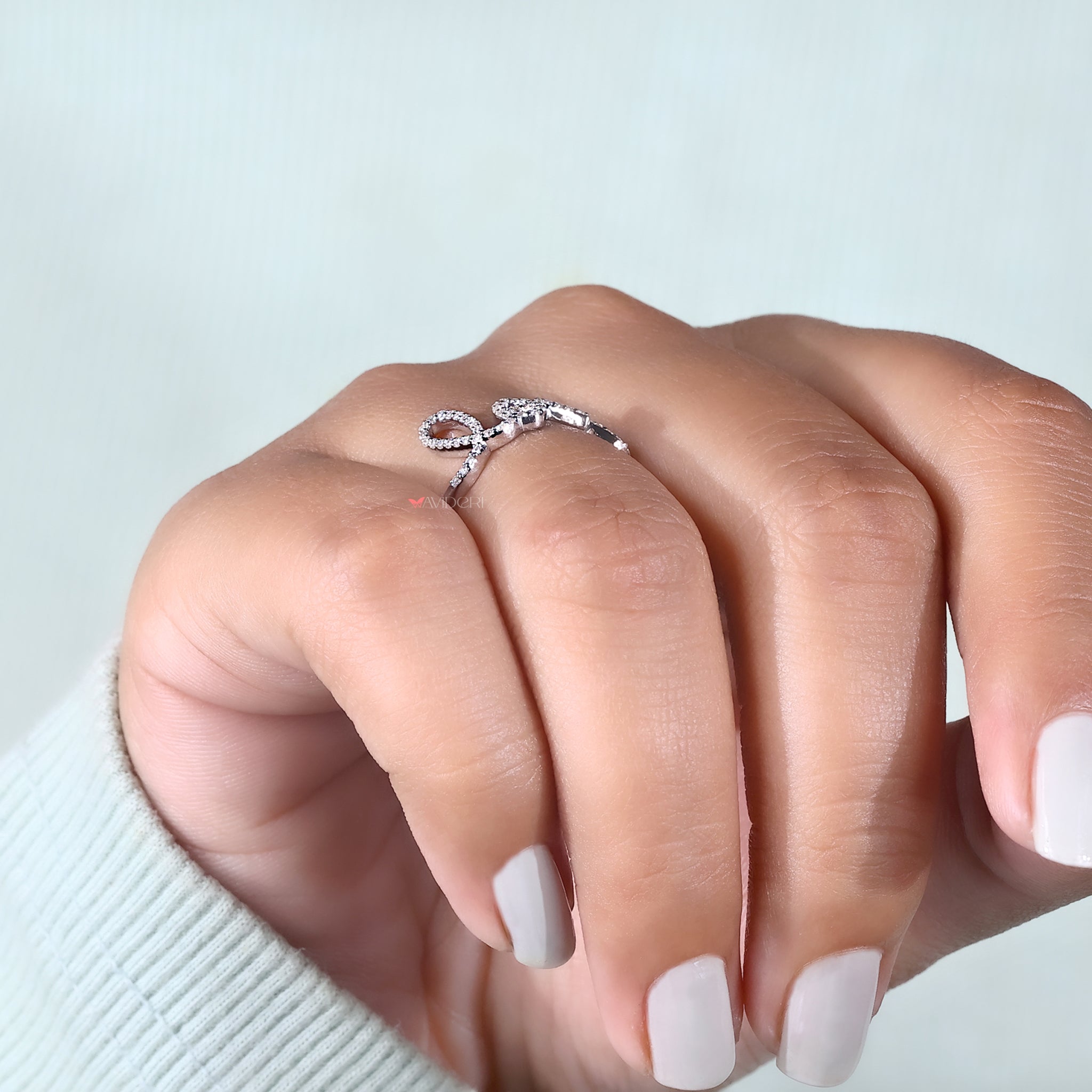 A pair of hands showcase the handmade jewelry set.