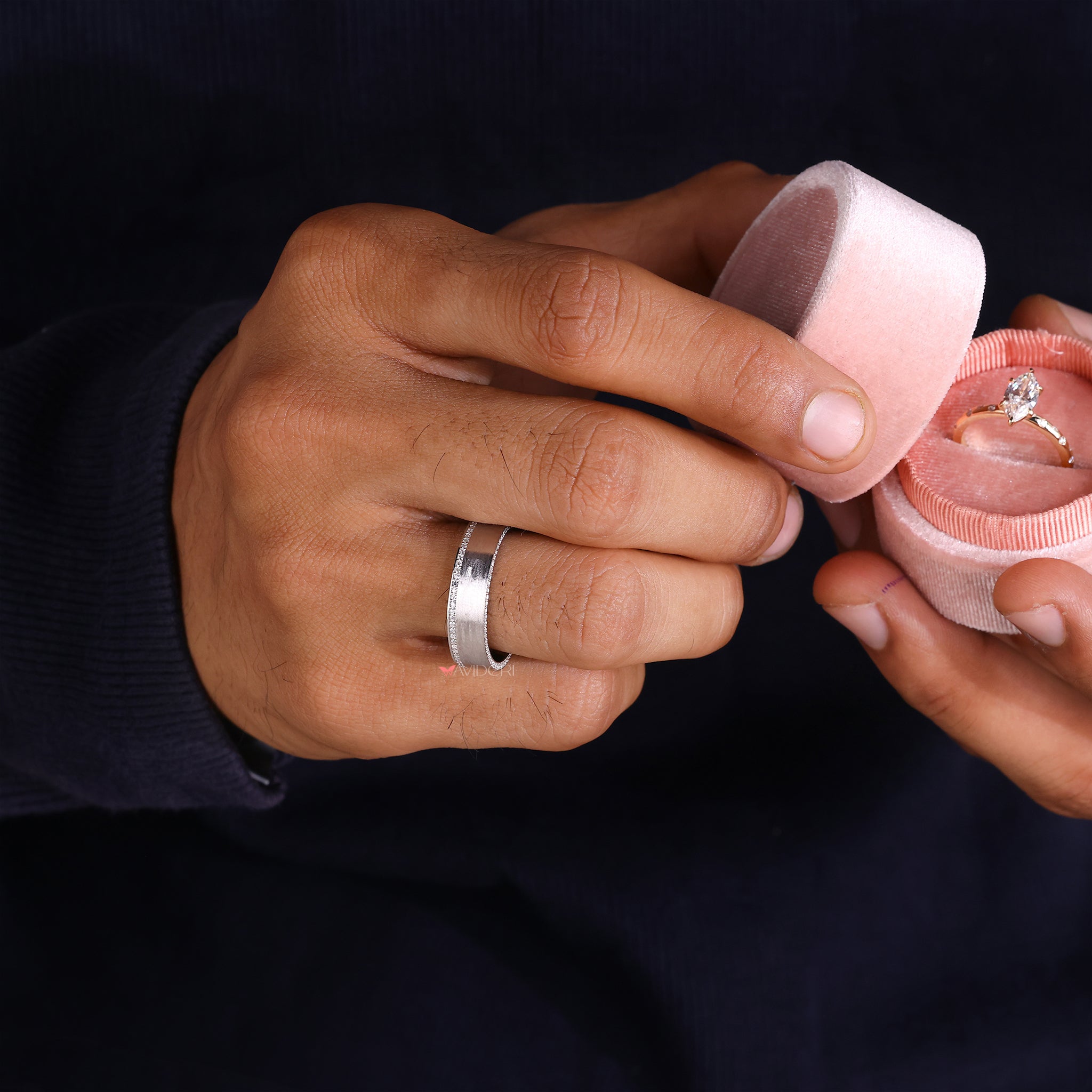 Mens pave wedding band offers shimmering detail with modern edge.