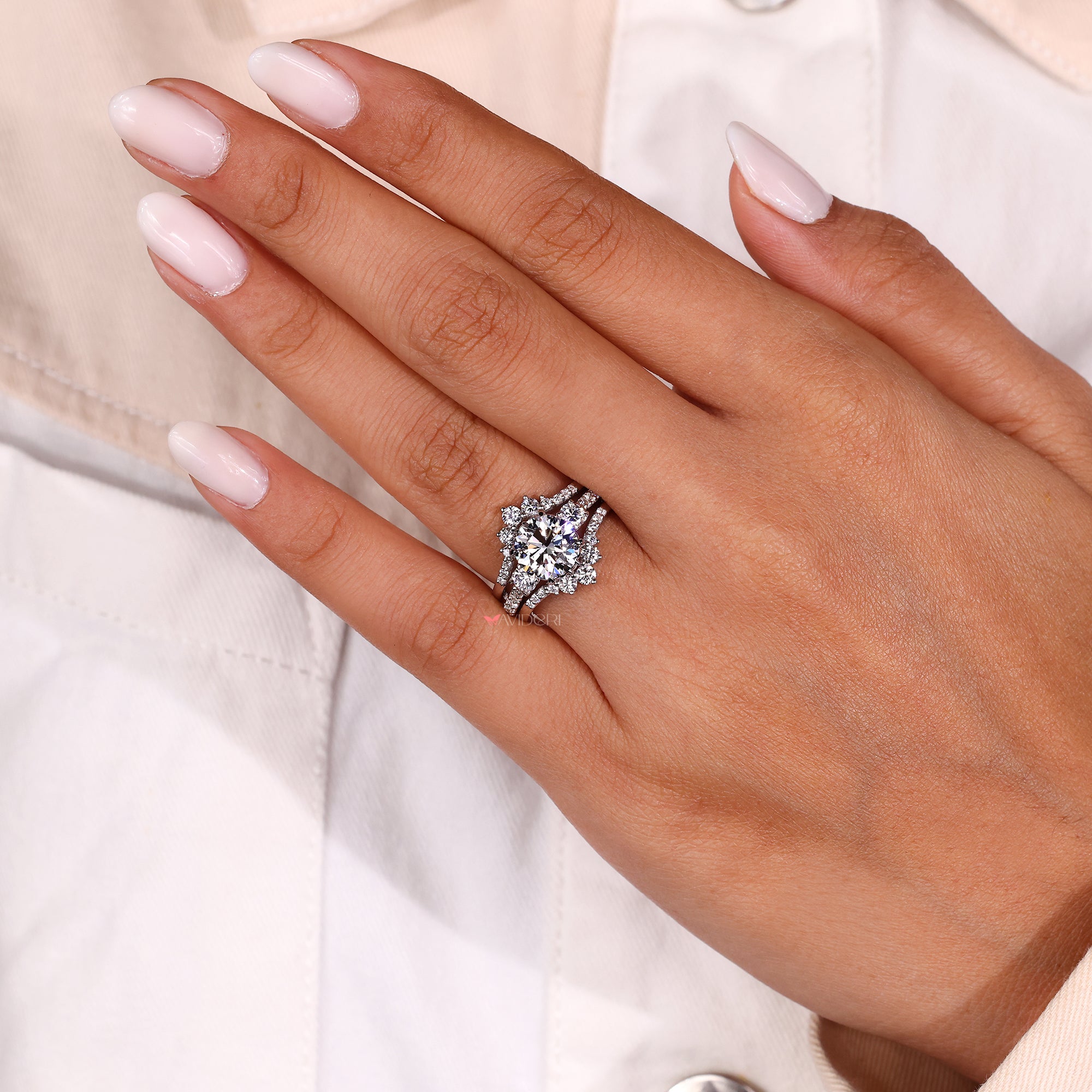 Designer white gold wrap band with round diamonds.