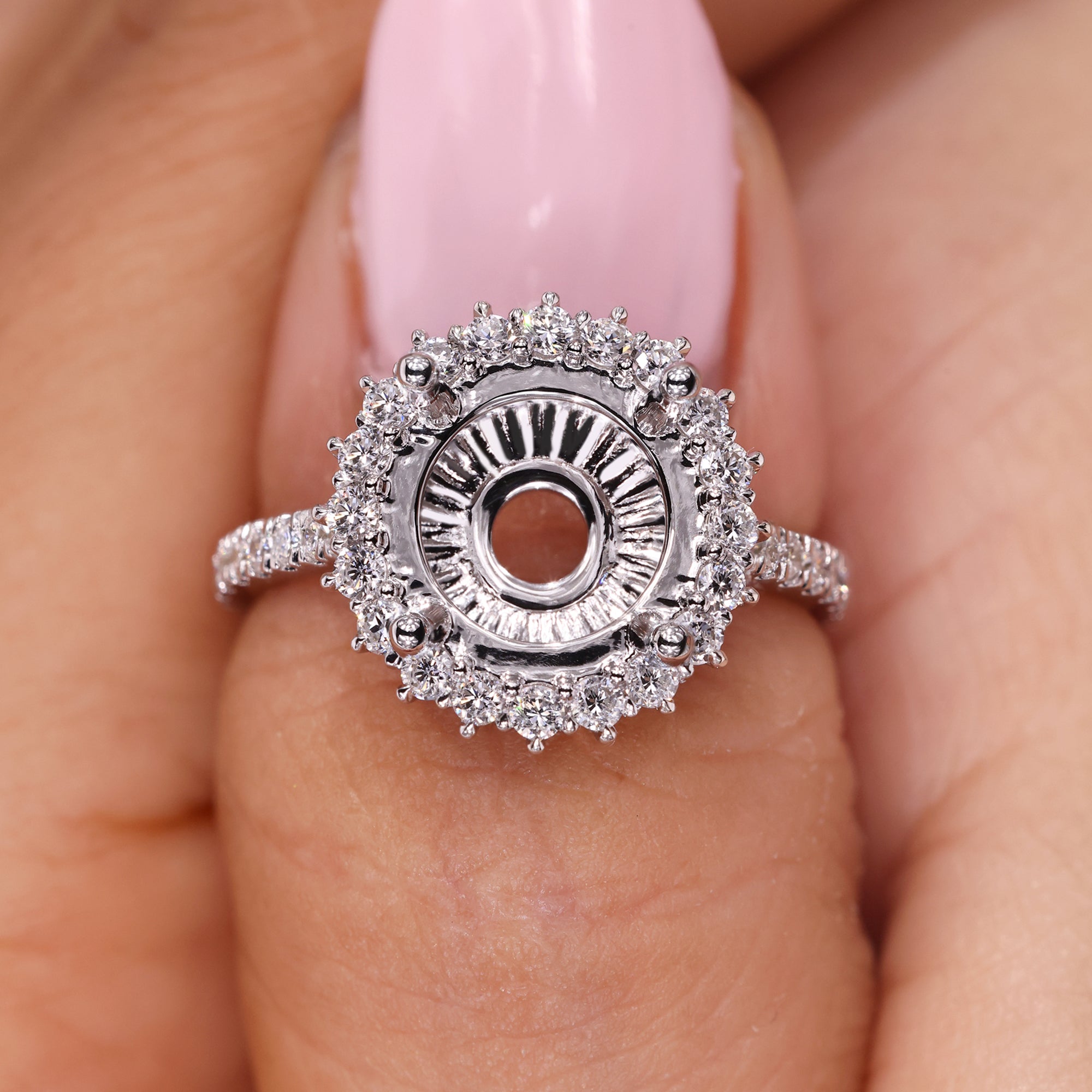 Semi mount engagement ring with cluster halo.