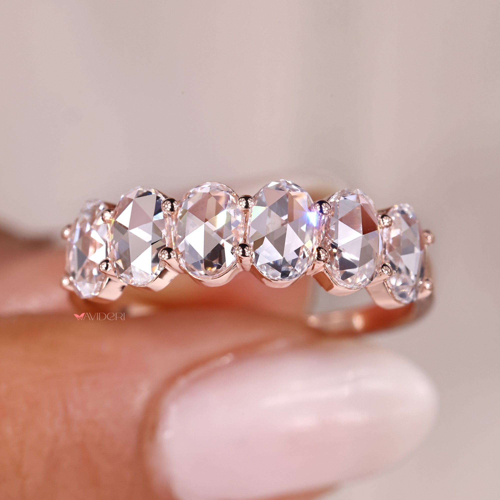 Shared prong rose cut wedding band in rose gold.