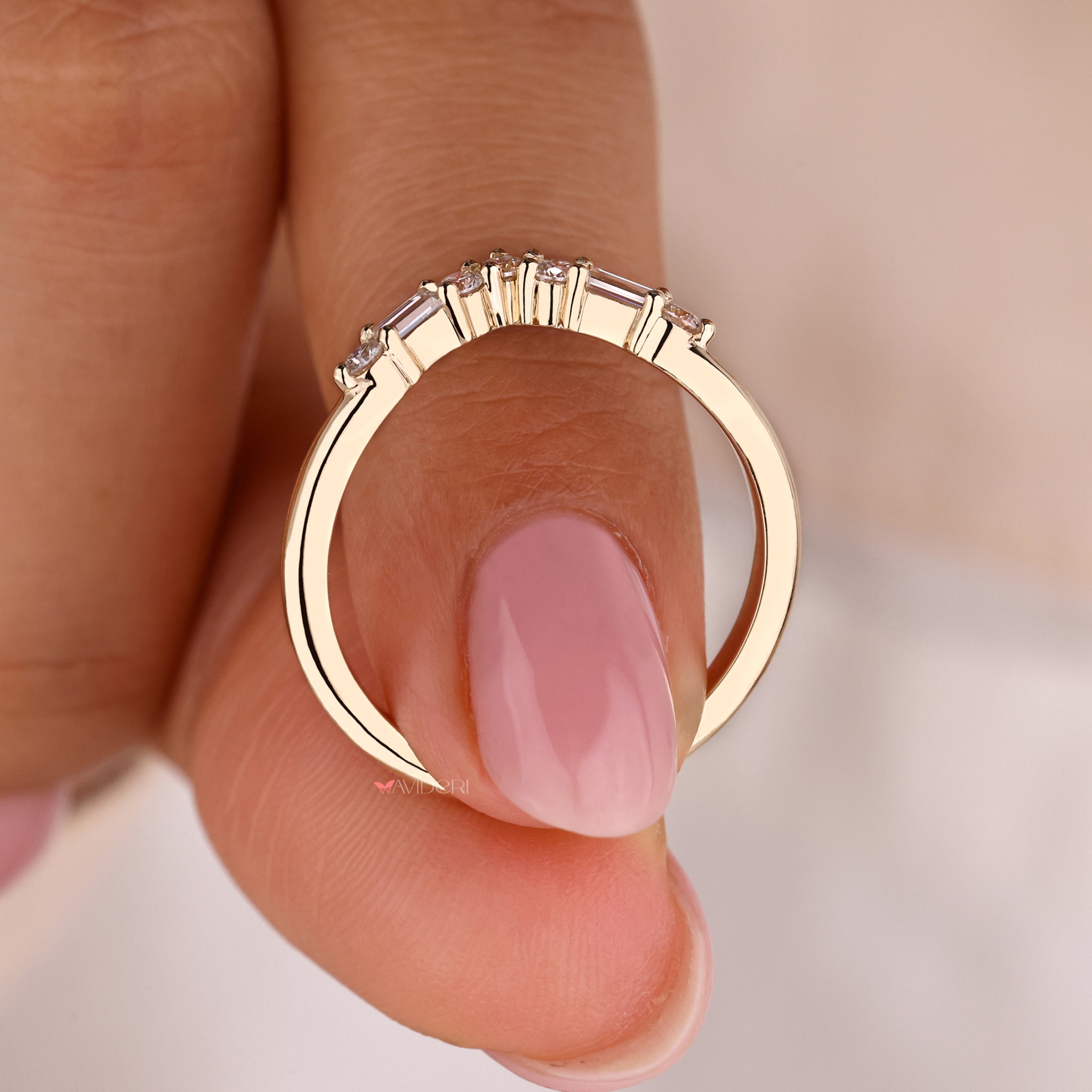 A unique curved wedding band with engagement ring set, showcasing both style and sophistication.