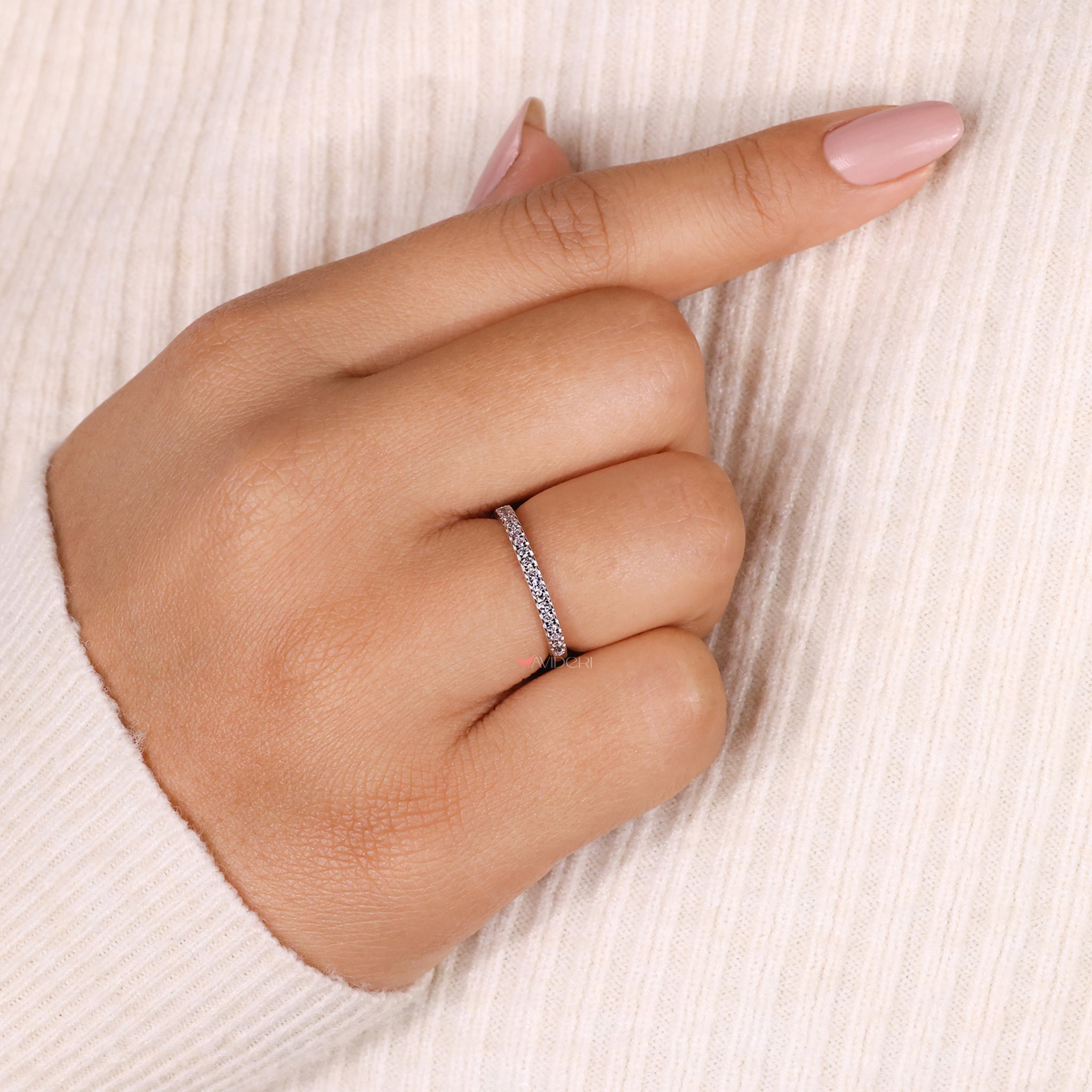 White gold custom wedding band with ethically sourced diamonds.