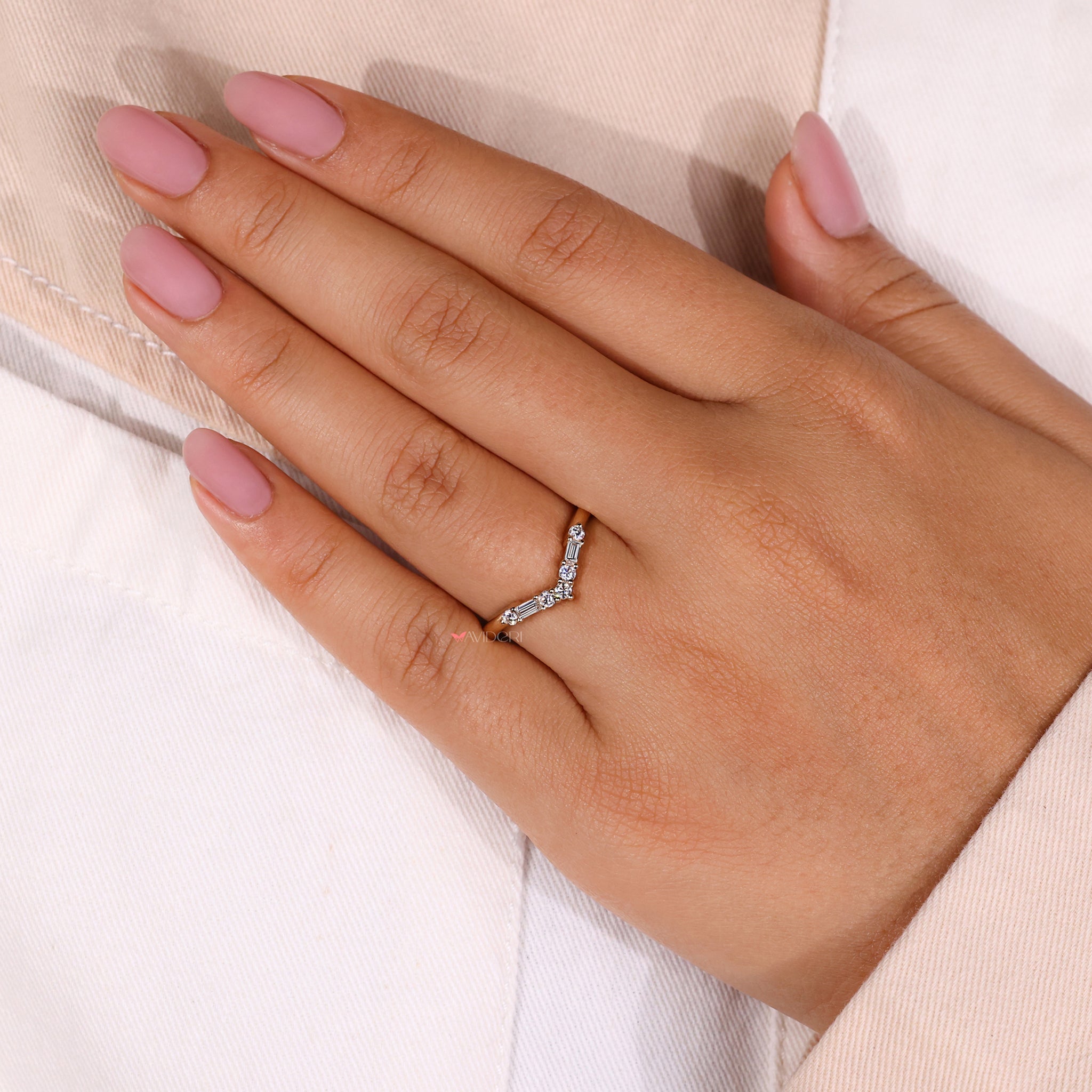 A stunning Baguette and round diamond band, featuring a mix of classic and modern styles.