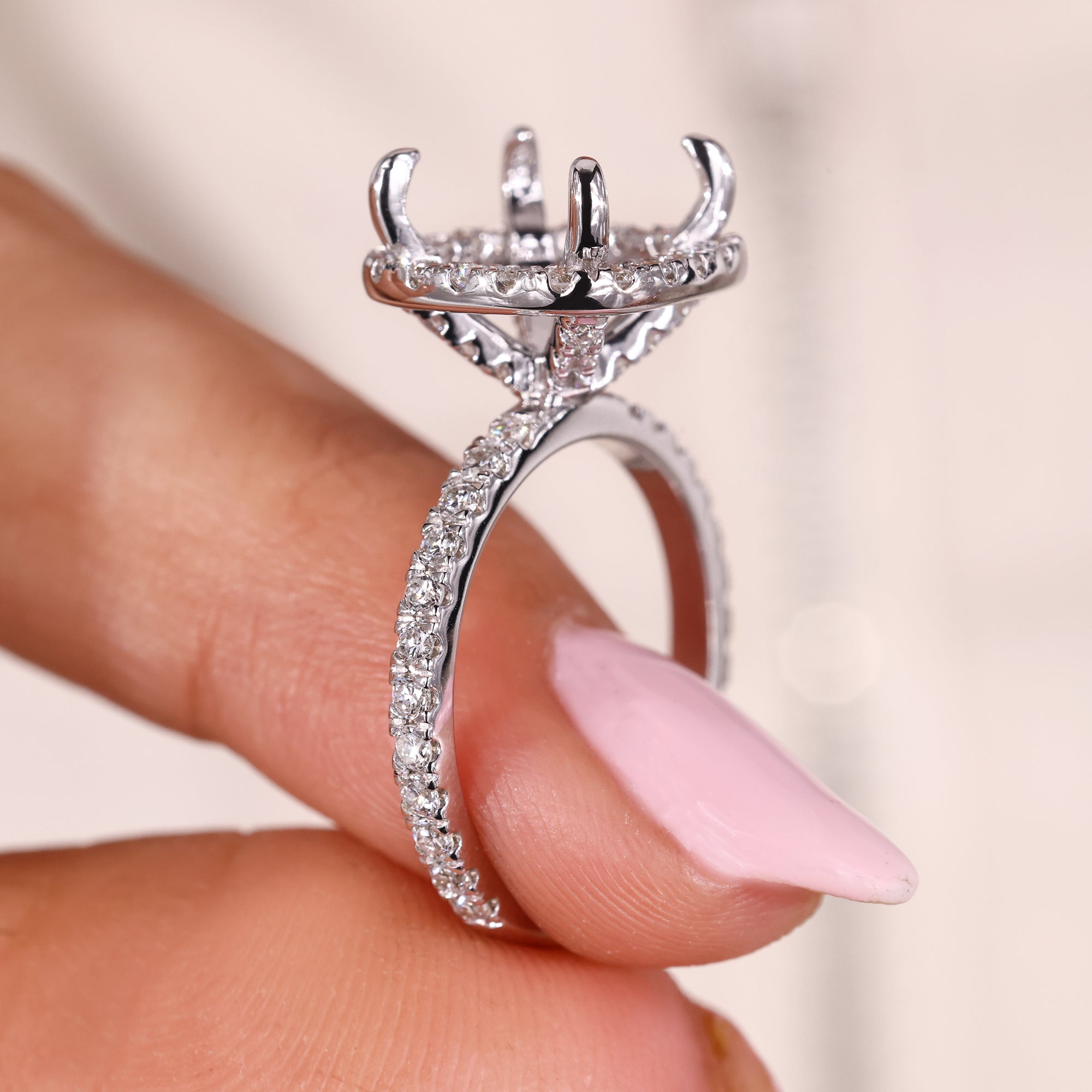 Semi mount engagement ring with pave halo setting.