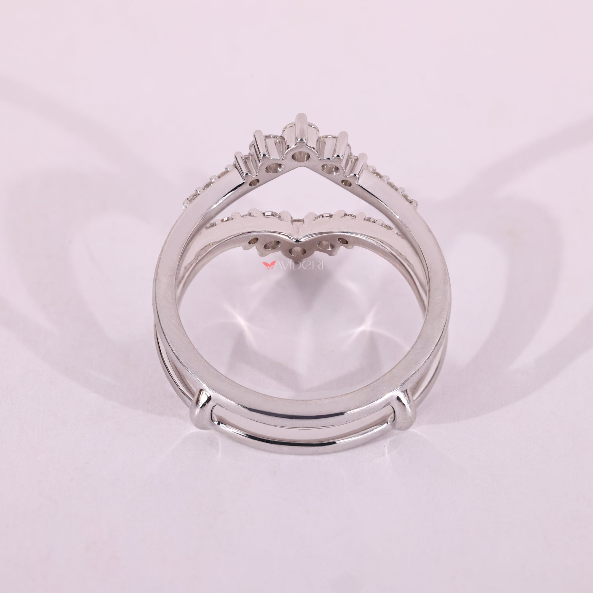 Custom wrap band with shared prongs and white gold finish.