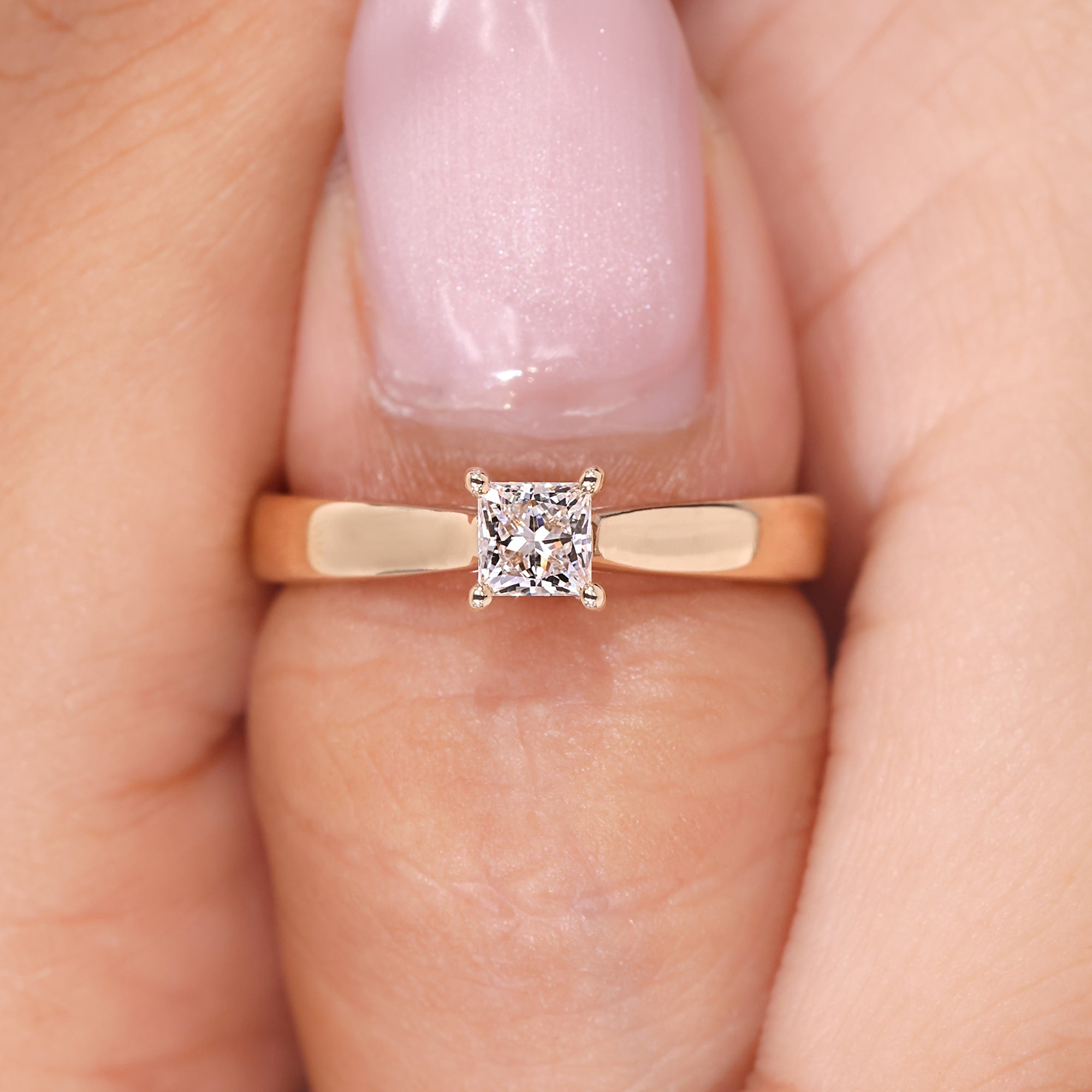 Princess diamond engagement ring in a four-prong setting, designed for a simple and clean look.