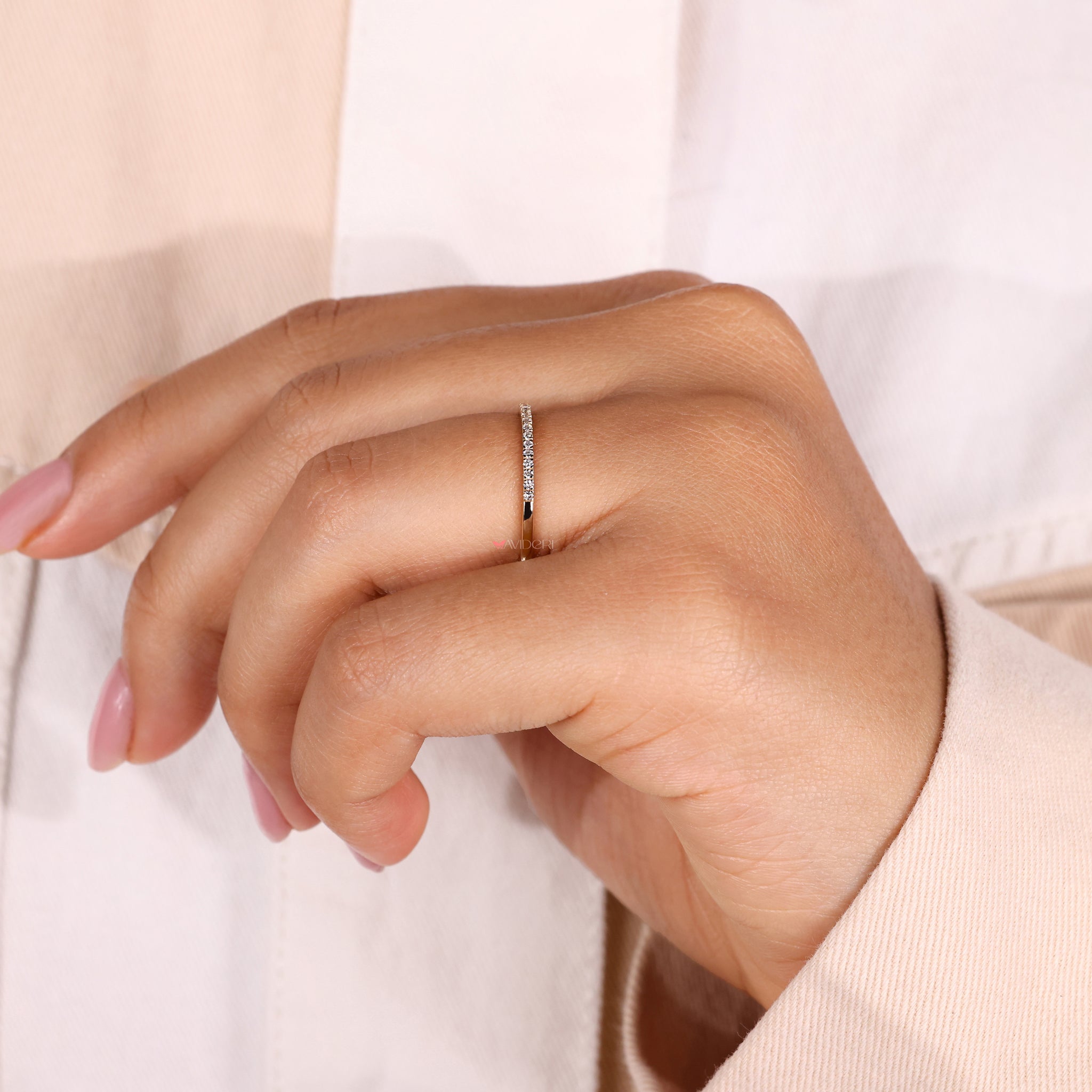 A diamond eternity band in yellow gold, designed for a classic and elegant style.