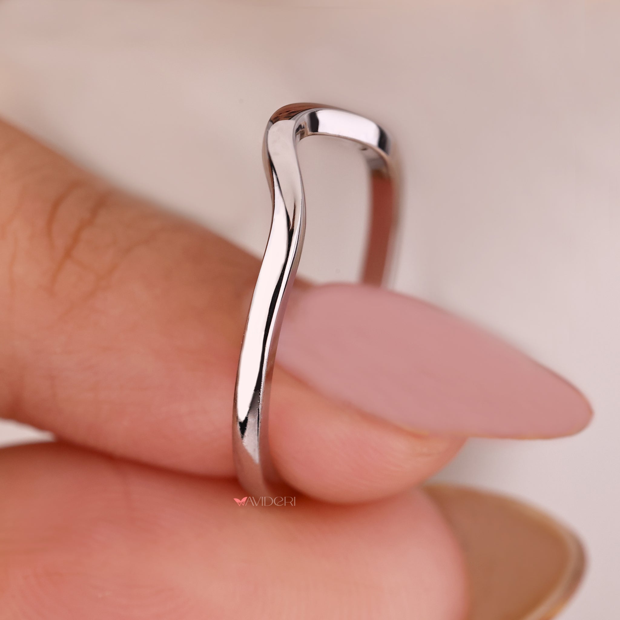 Curved wedding band designed to complement any engagement ring.