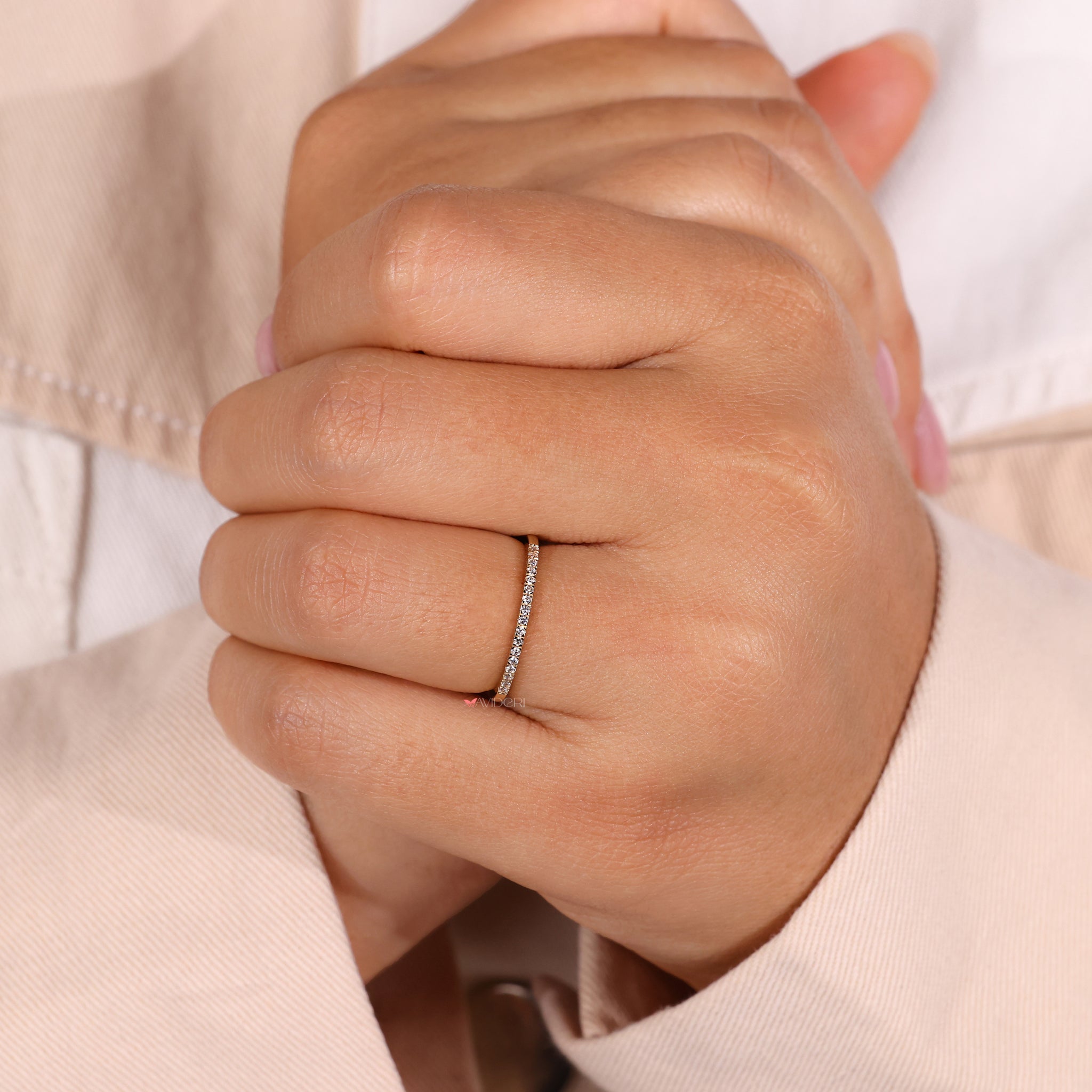A micro pave wedding band featuring lab-grown diamonds in a low set eternity band style.