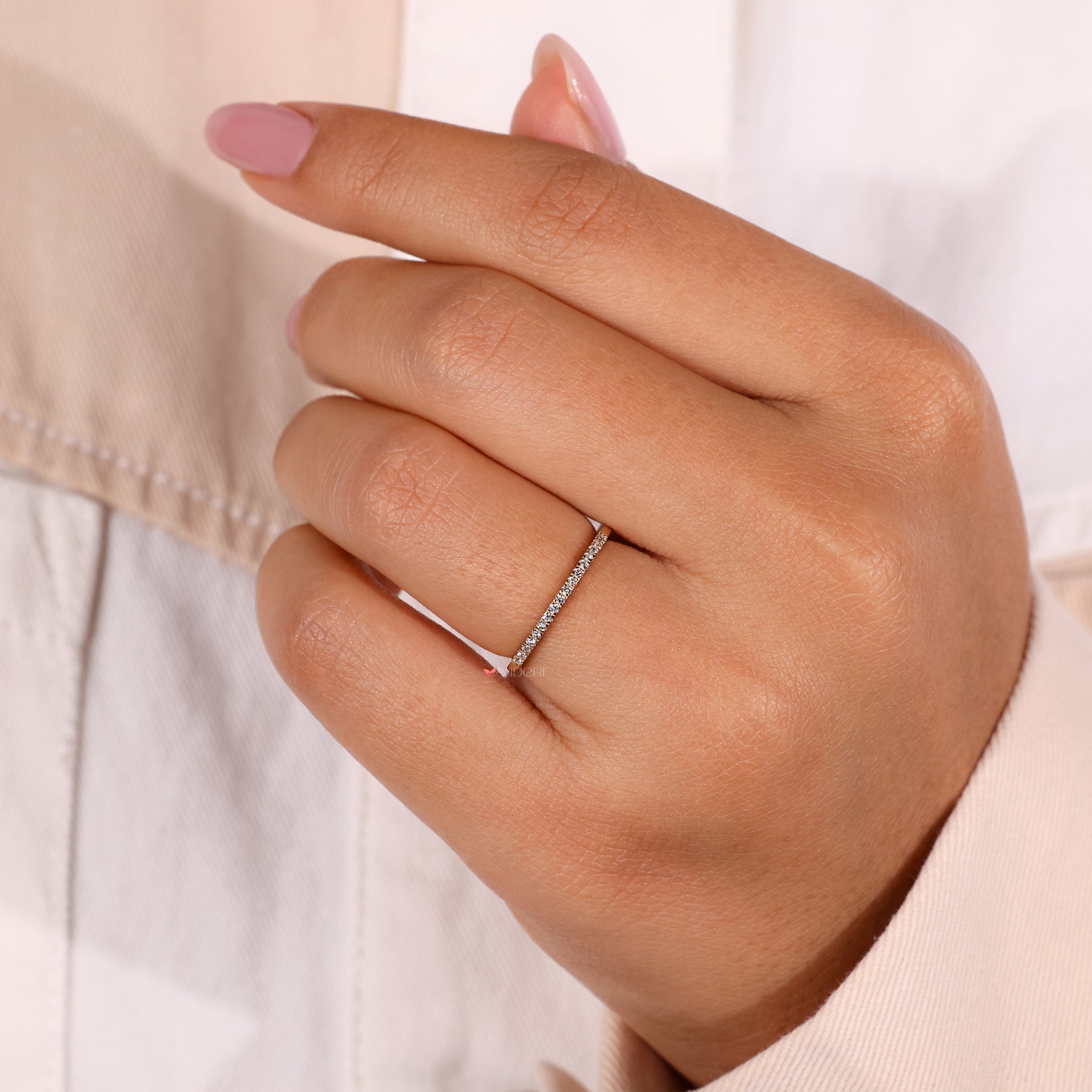 A wedding band made of yellow gold with diamonds in a timeless eternity style.