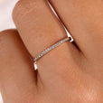 A thin diamond wedding band featuring micro pave diamonds, perfect for elegant weddings.