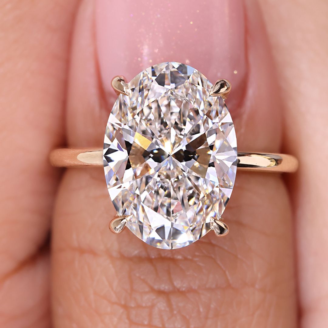 5 Carat Oval Cut Engagement Ring Solitaire Setting featuring a stunning oval diamond set in a yellow gold band.