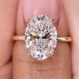 5 Carat Oval Cut Engagement Ring Solitaire Setting featuring a stunning oval diamond set in a yellow gold band.