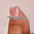 Round diamond wedding band featuring an elegant shared prong setting.
 Round diamond wedding band featuring an elegant shared prong setting.