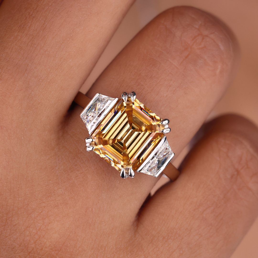 Emerald trapezoid engagement ring with stunning design.