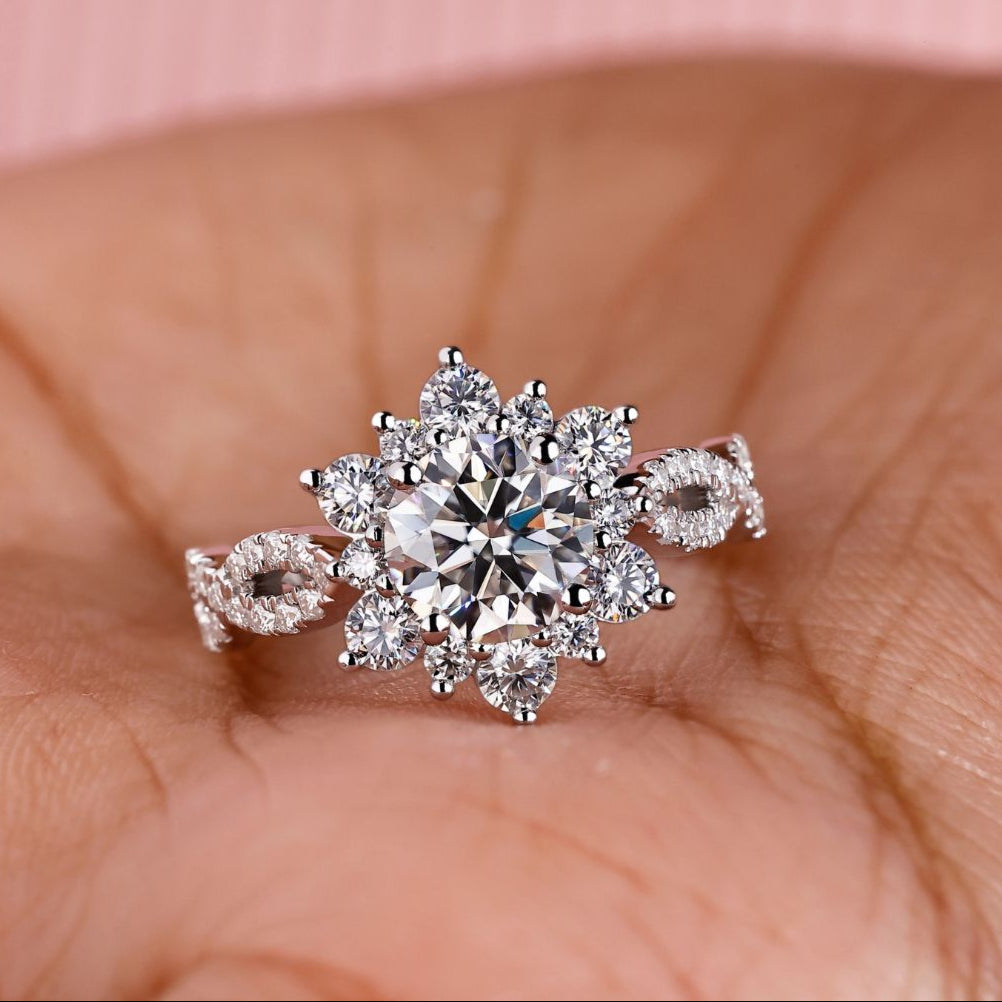 This round brilliant cut engagement ring features a radiant center design.