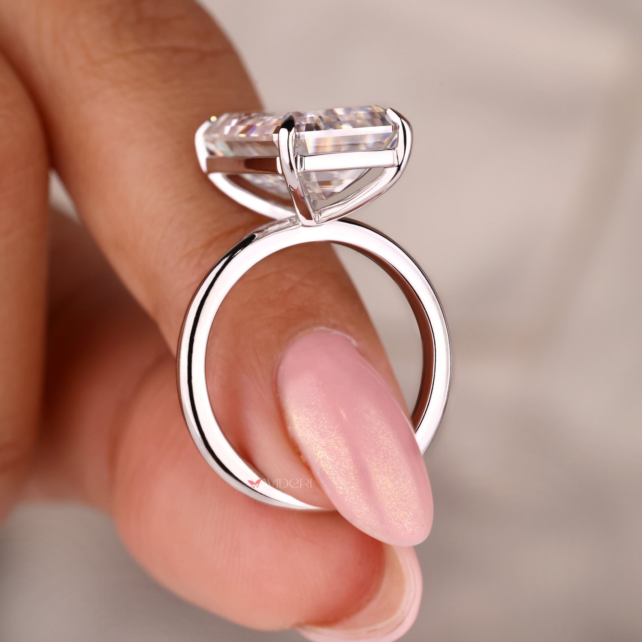 Long emerald cut ring set in a stunning white gold ring.