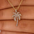 Gold palm tree pendant featuring intricate details.
 Gold palm tree pendant featuring intricate details.