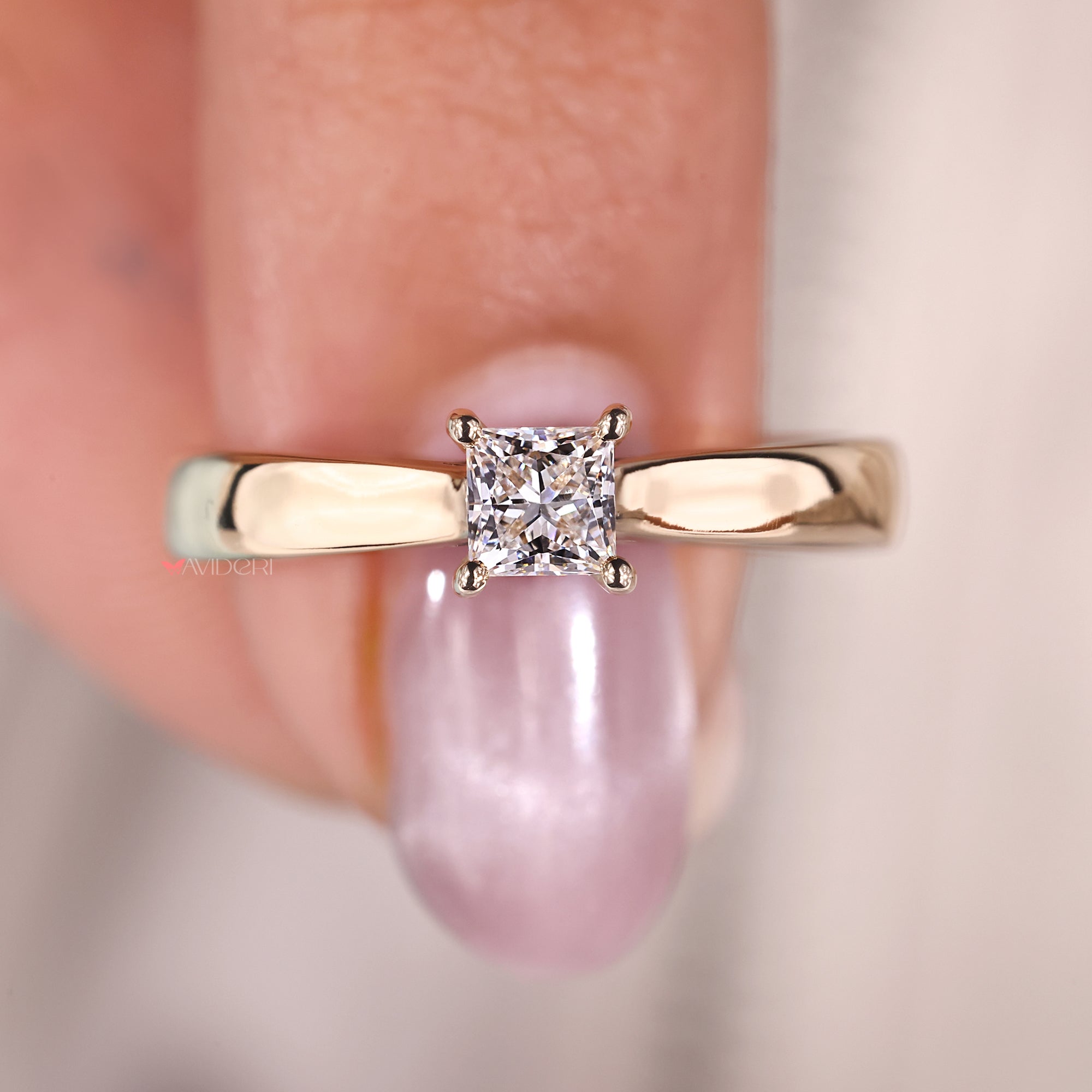 Buy engagement ring featuring a princess diamond and tapered shank, perfect for a contemporary look.