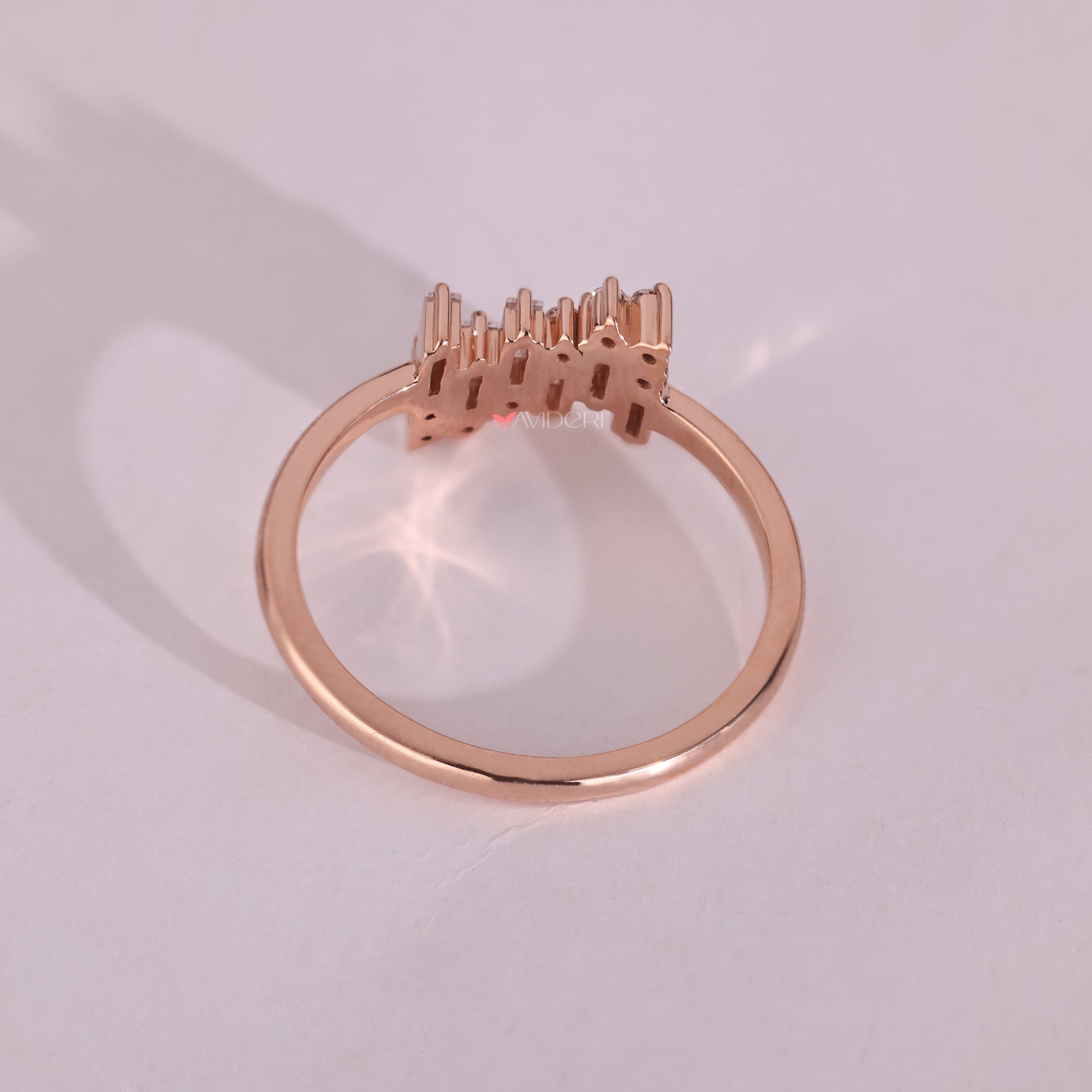 Rose gold engagement ring with a round diamond center, offering a romantic and warm touch.