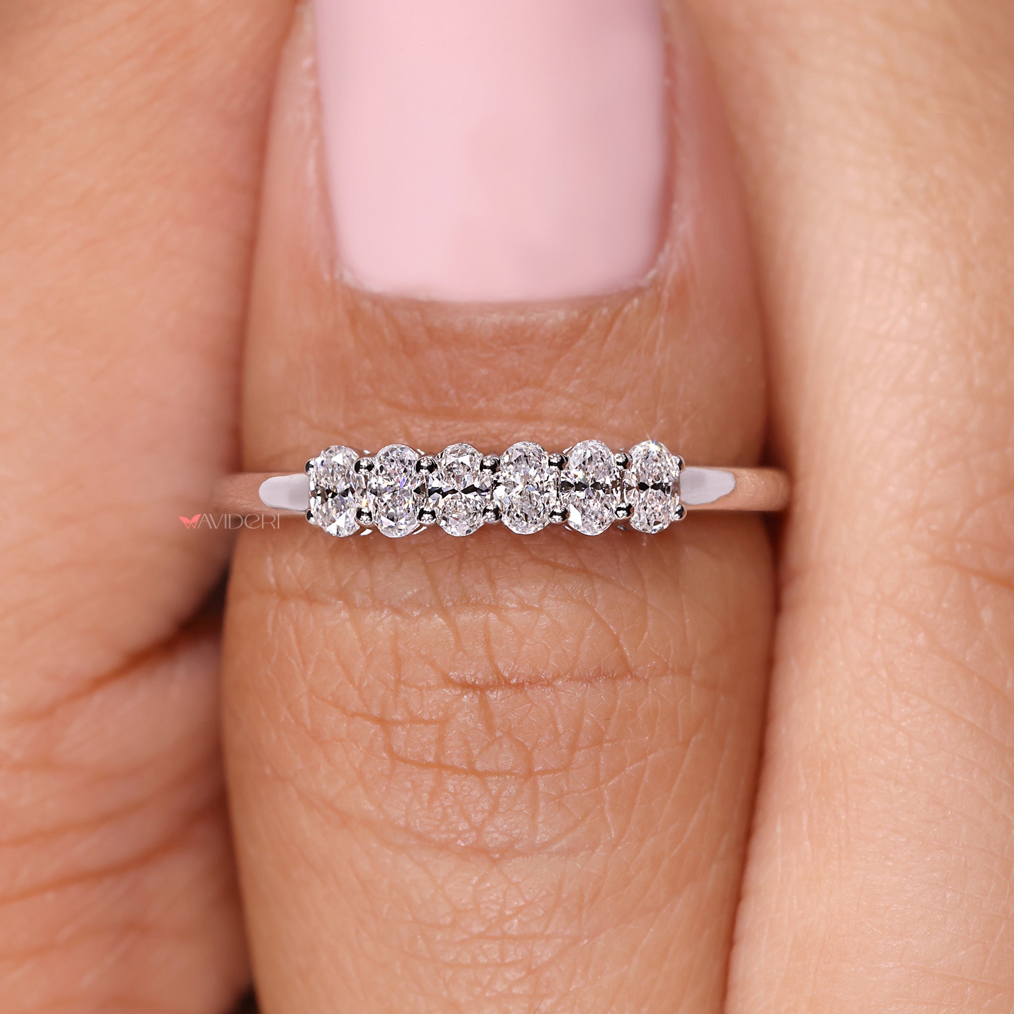 A six stone shared prong ring with balanced elegance.