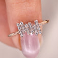 Anniversary gifts for her include this baguette diamond ring, set in a beautiful rose gold band.