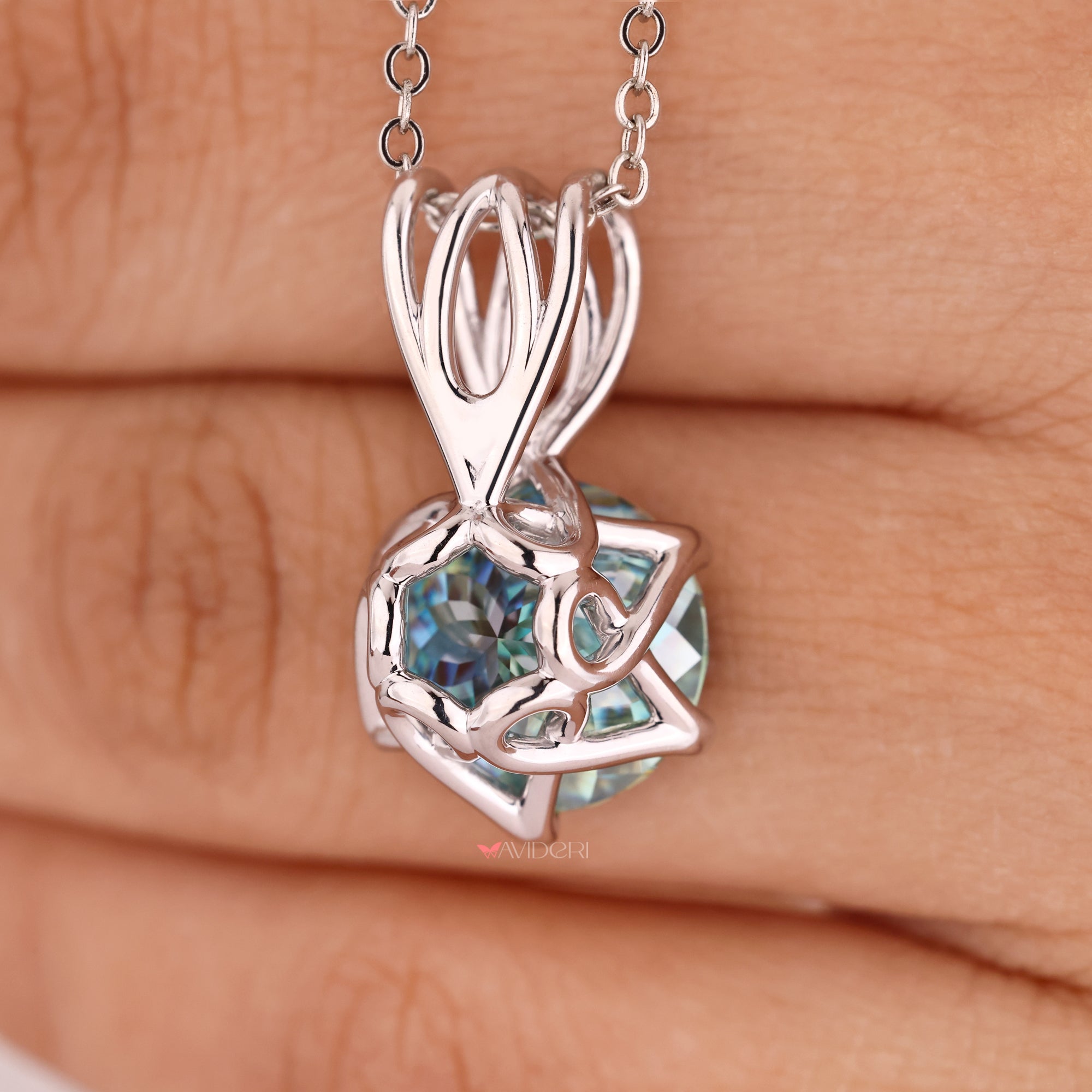 Avideri pendant with a bright blue center stone.