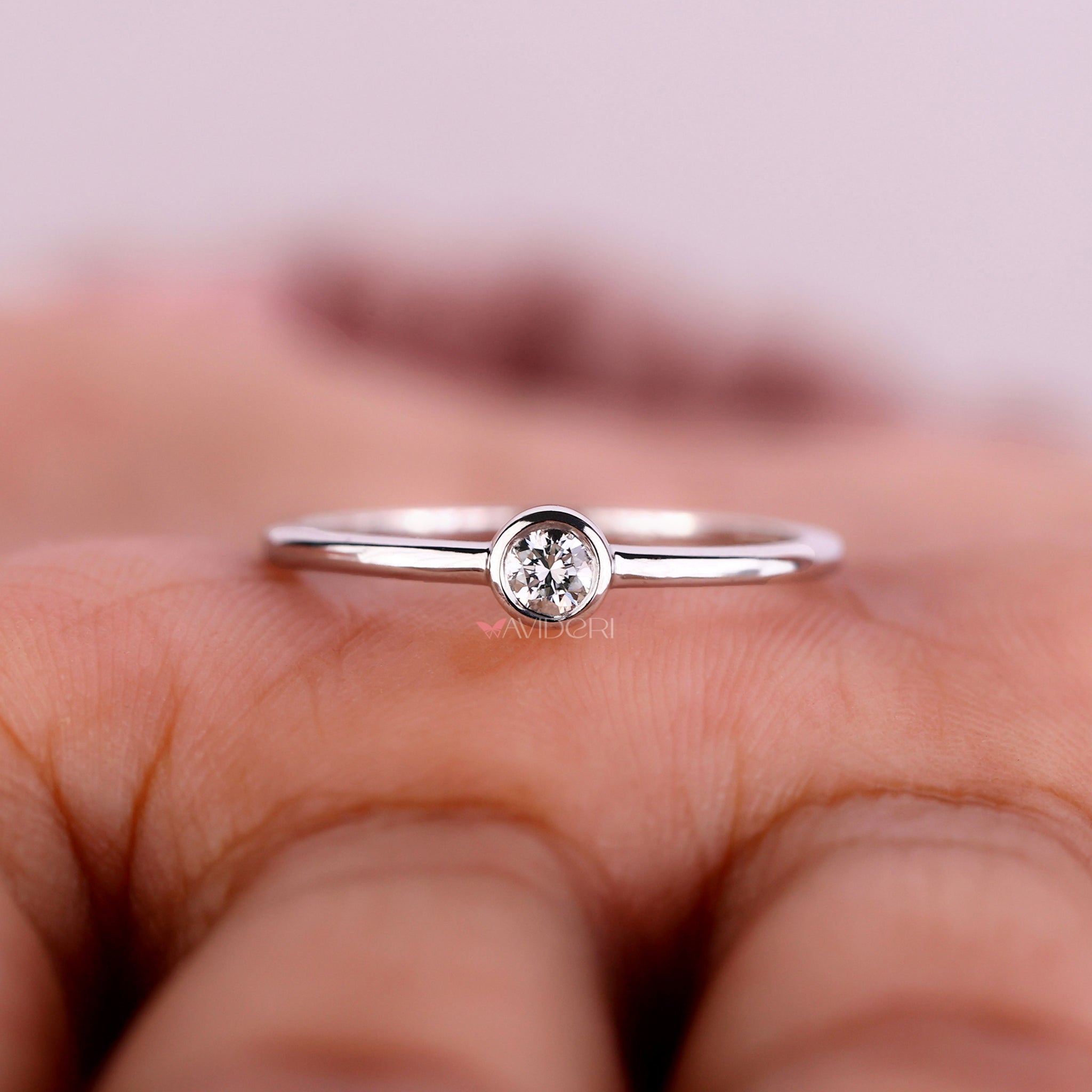 Solitaire bezel ring showcasing an IGI certified diamond with unmatched sparkle and brilliance.