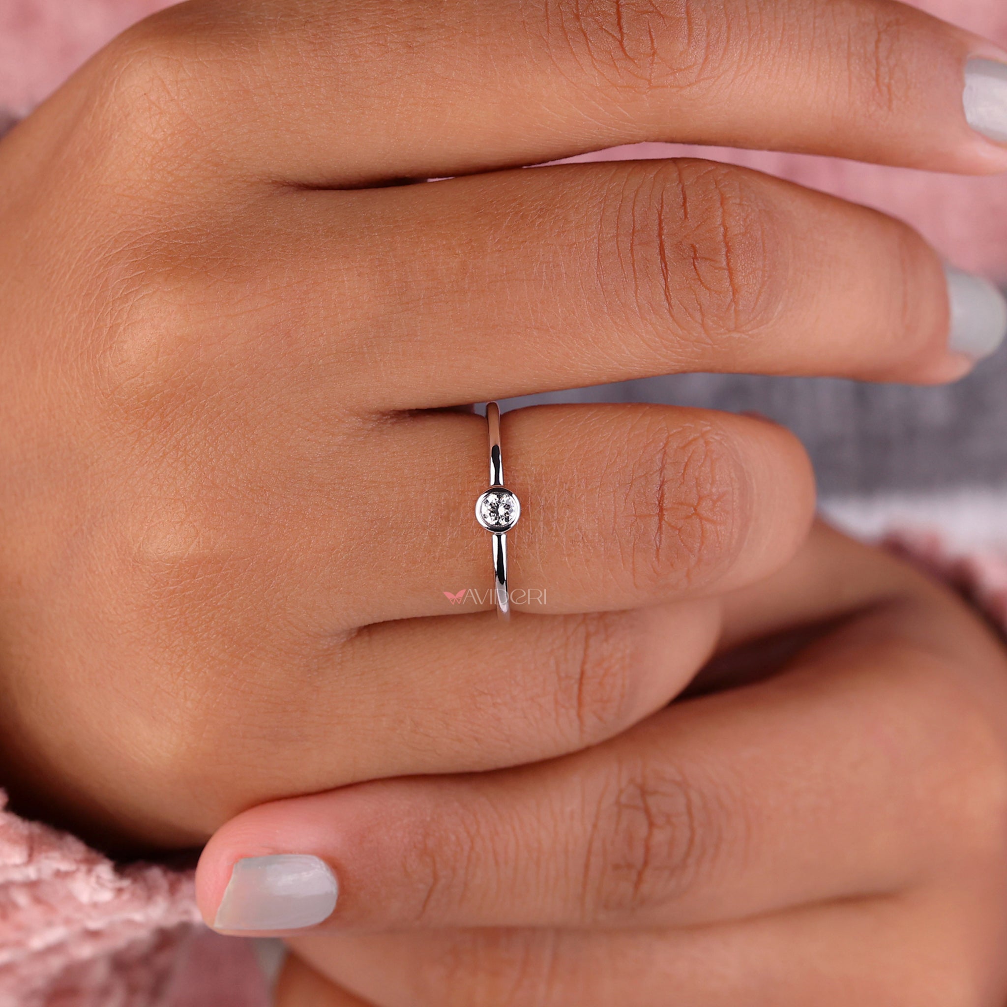 Handmade ring with a bezel setting highlighting a beautiful lab grown diamond for eco-conscious elegance.