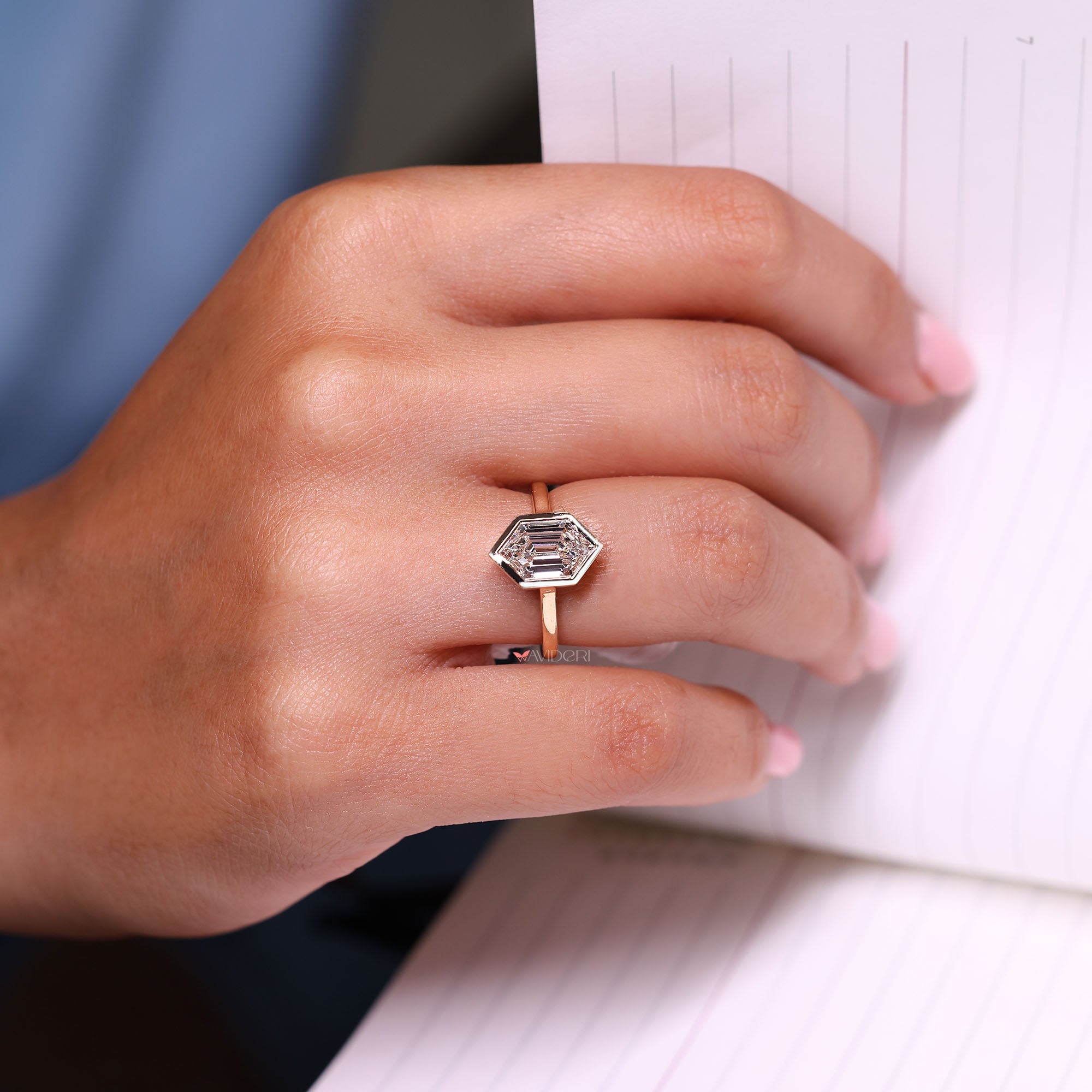 Bezel set diamond ring crafted in a solitaire setting.