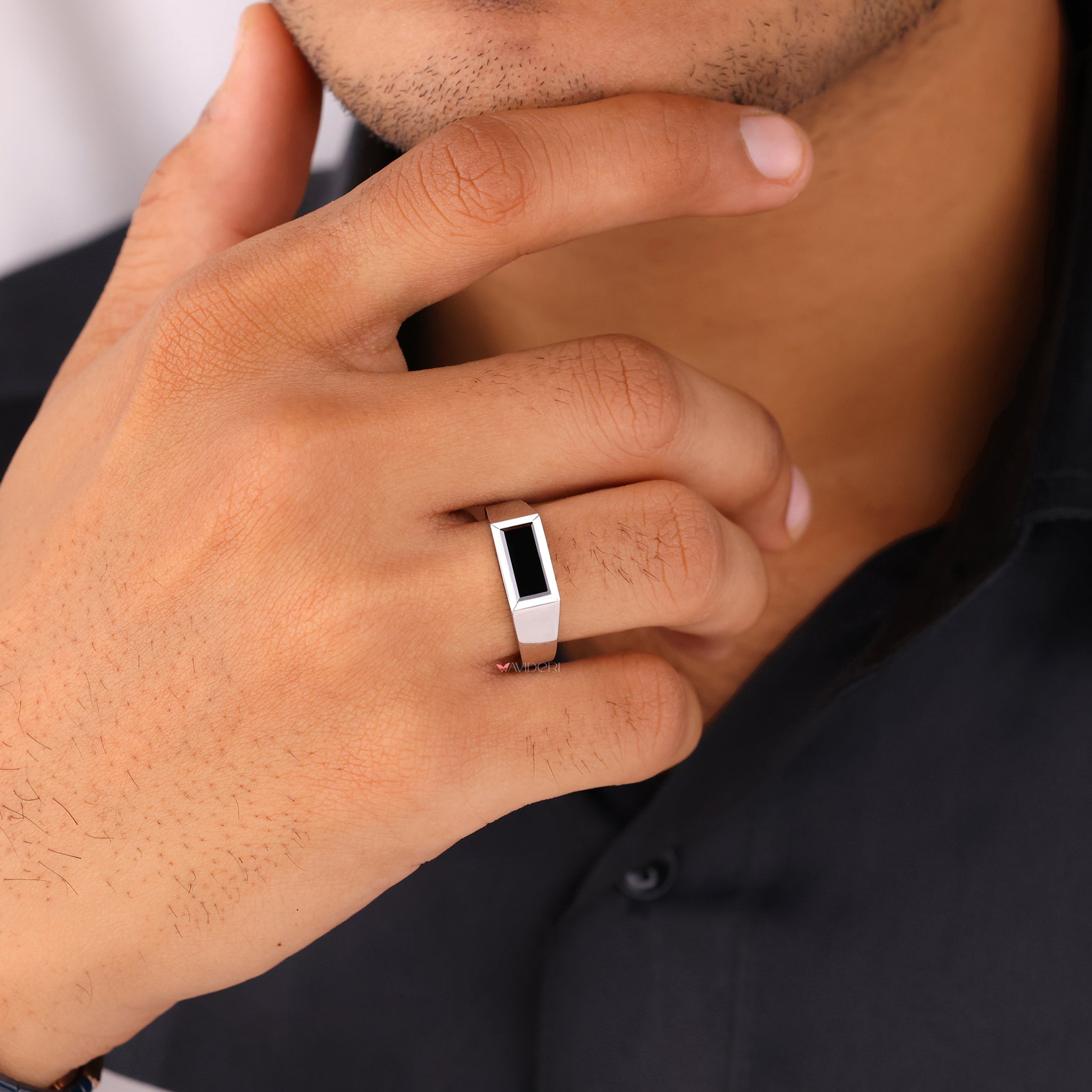 Black baguette ring featuring sleek detailing