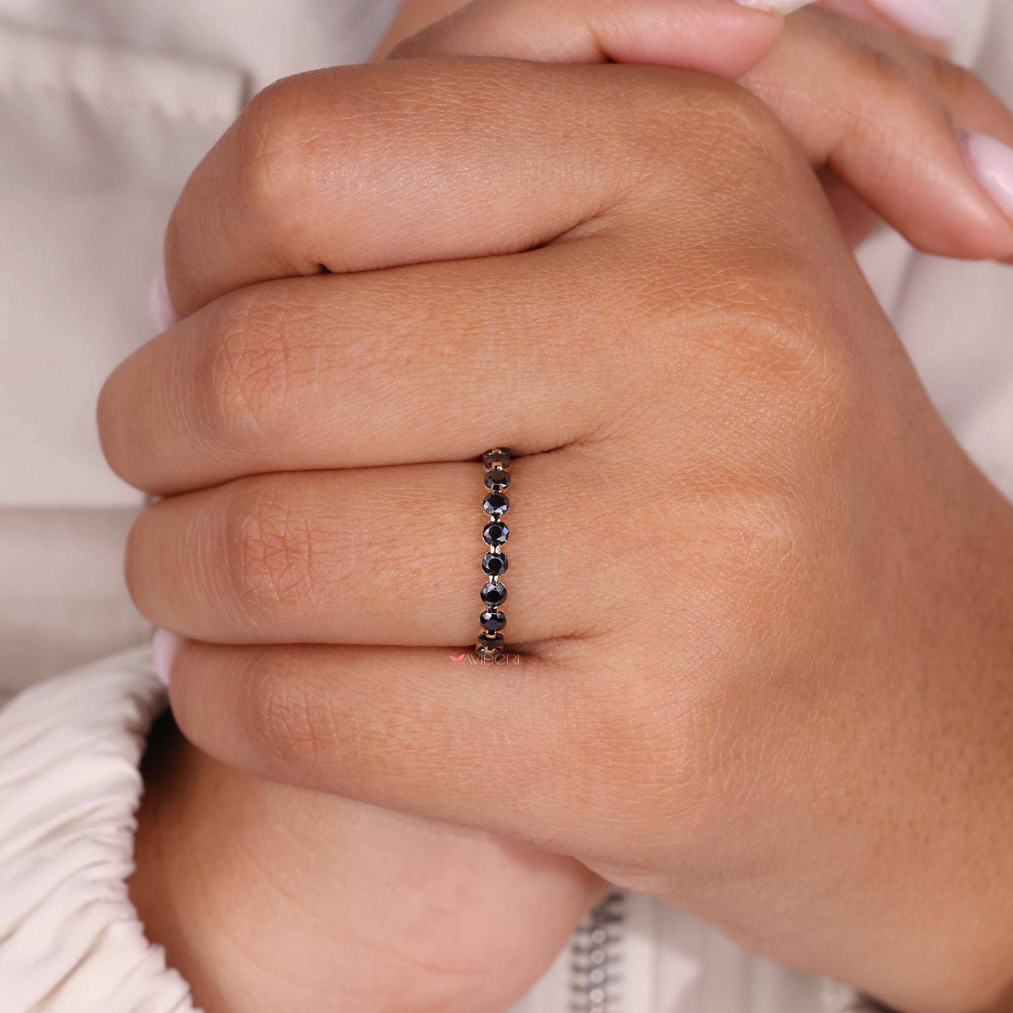 A shared prong wedding band provides secure placement for stones.