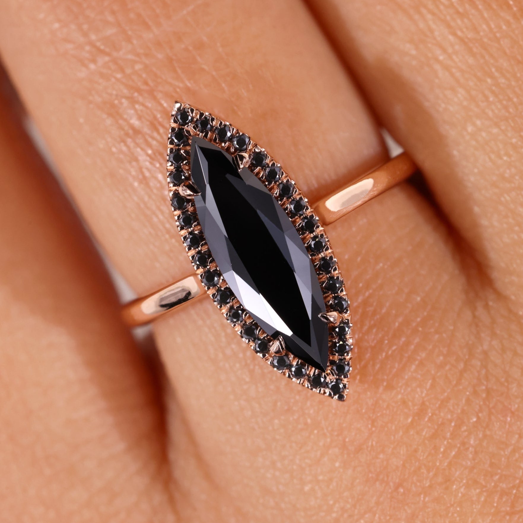 A long marquise ring set in a sleek band.