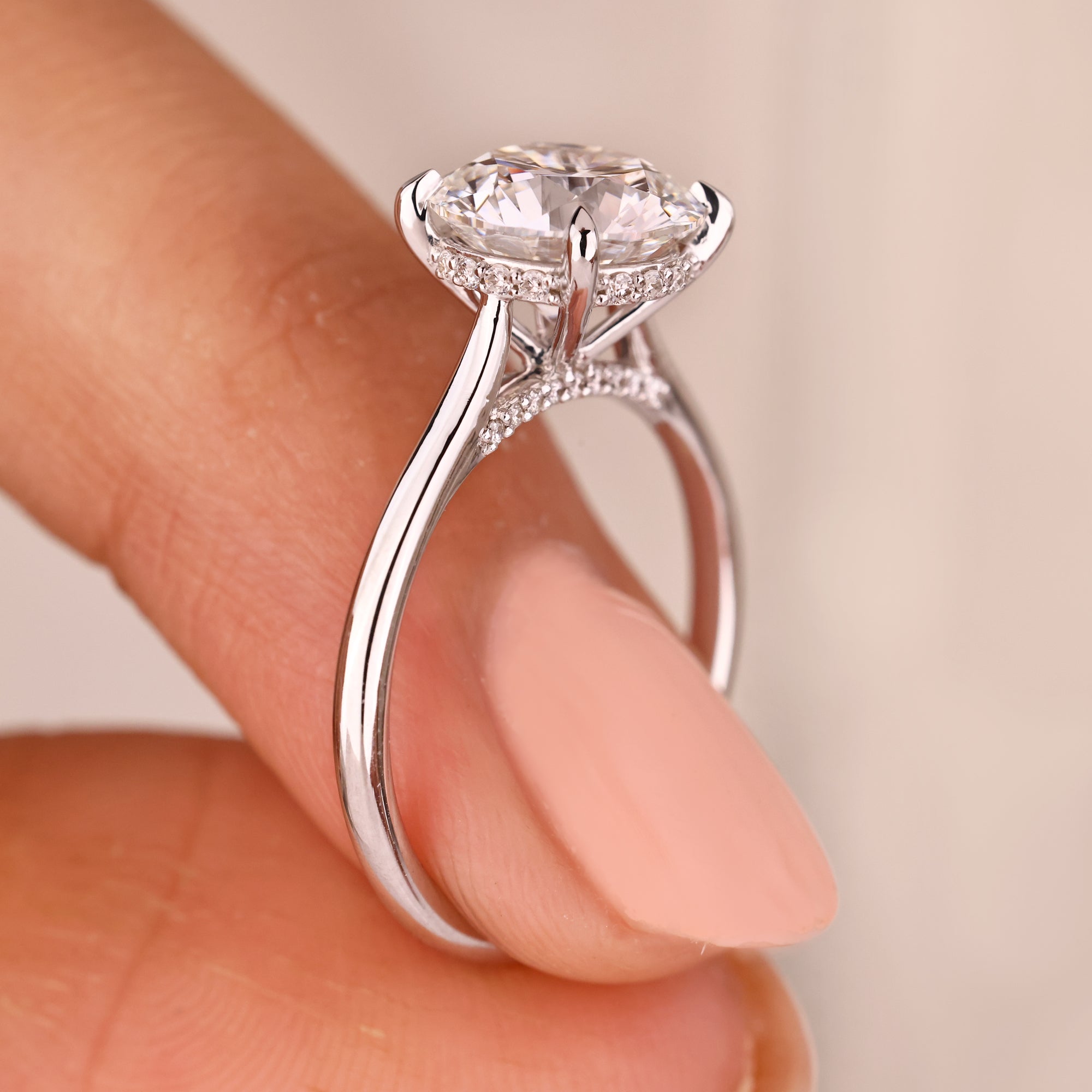 Hidden diamond accent round solitaire ring by Avideri.
