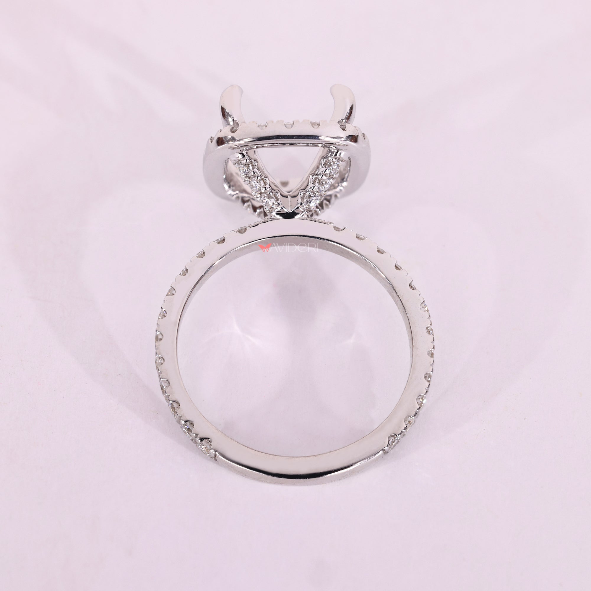 White gold semi mount ring with halo design.