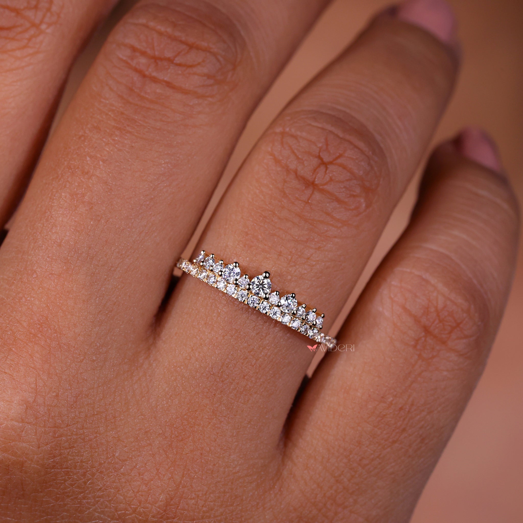Prong setting band featuring round diamonds.