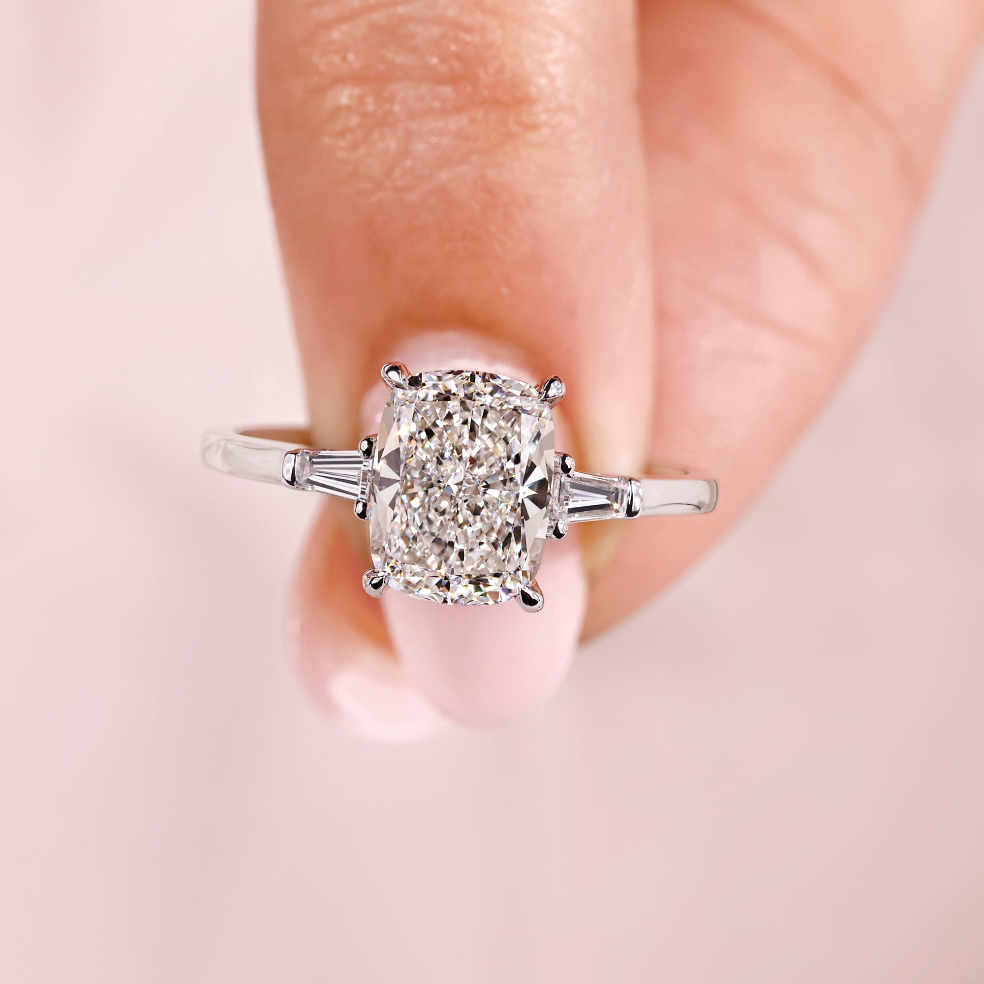 4 claw prong setting with white gold engagement ring.
