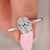 Cushion cut diamond ring set in round cut side stone design. Cushion cut diamond ring set in round cut side stone design.