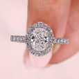 Cushion diamond engagement ring with double claw prong.
