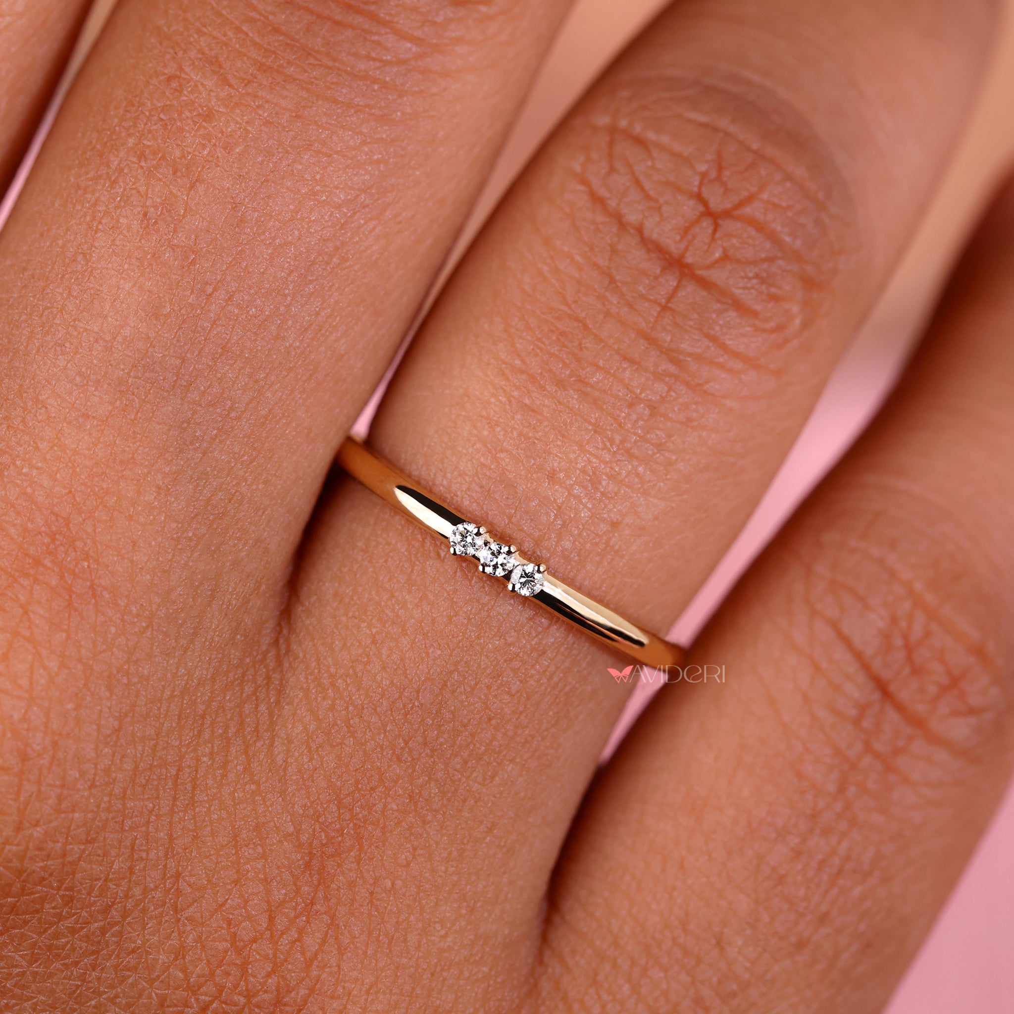 3 stone diamond wedding band with delicate details.