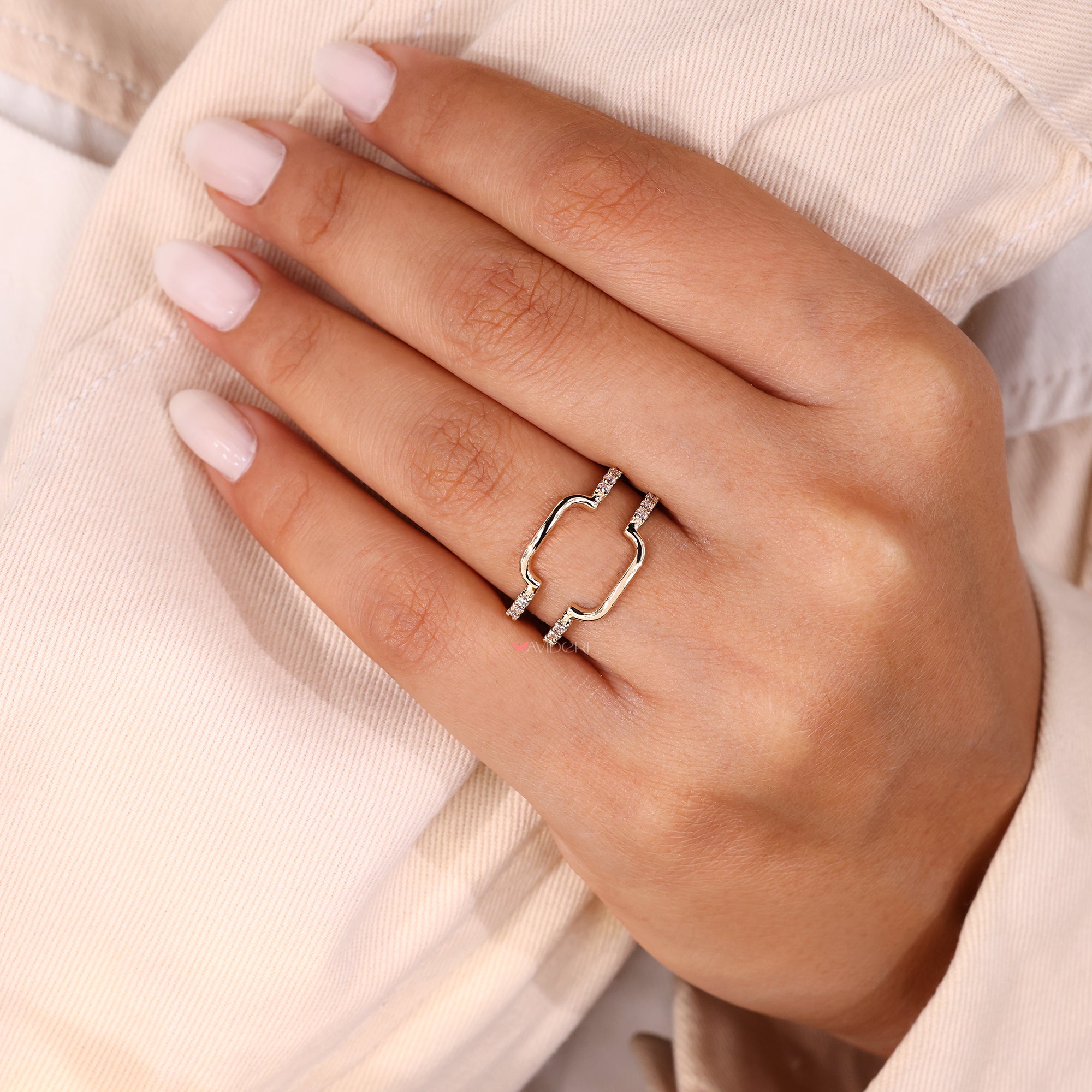 Handmade jewelry featuring moissanite wrap wedding band.