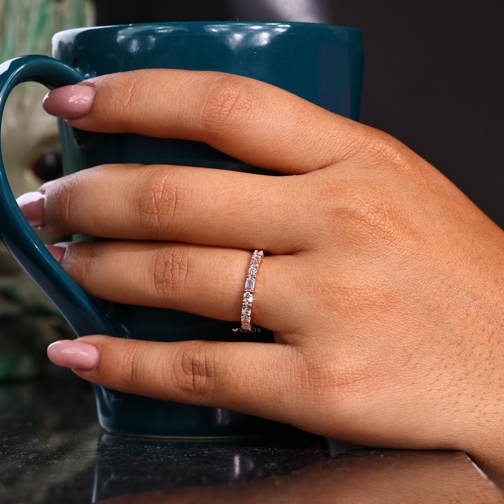 Eternity band with emerald-cut diamonds set in a sleek design.