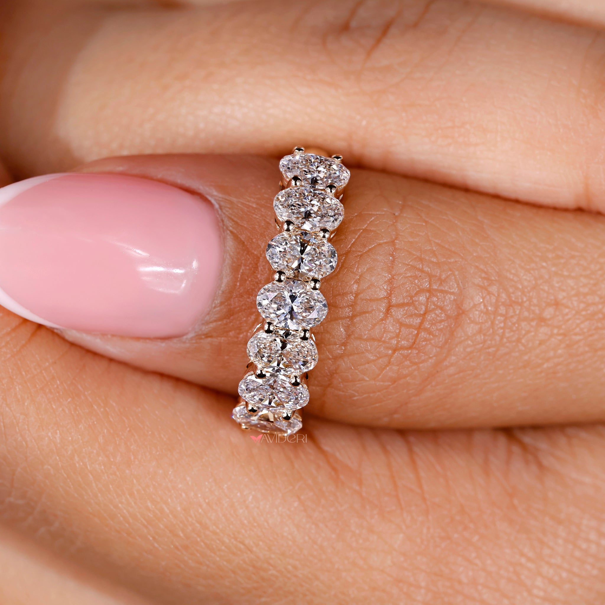 Yellow gold diamond band showcasing sparkling oval diamonds for elegance