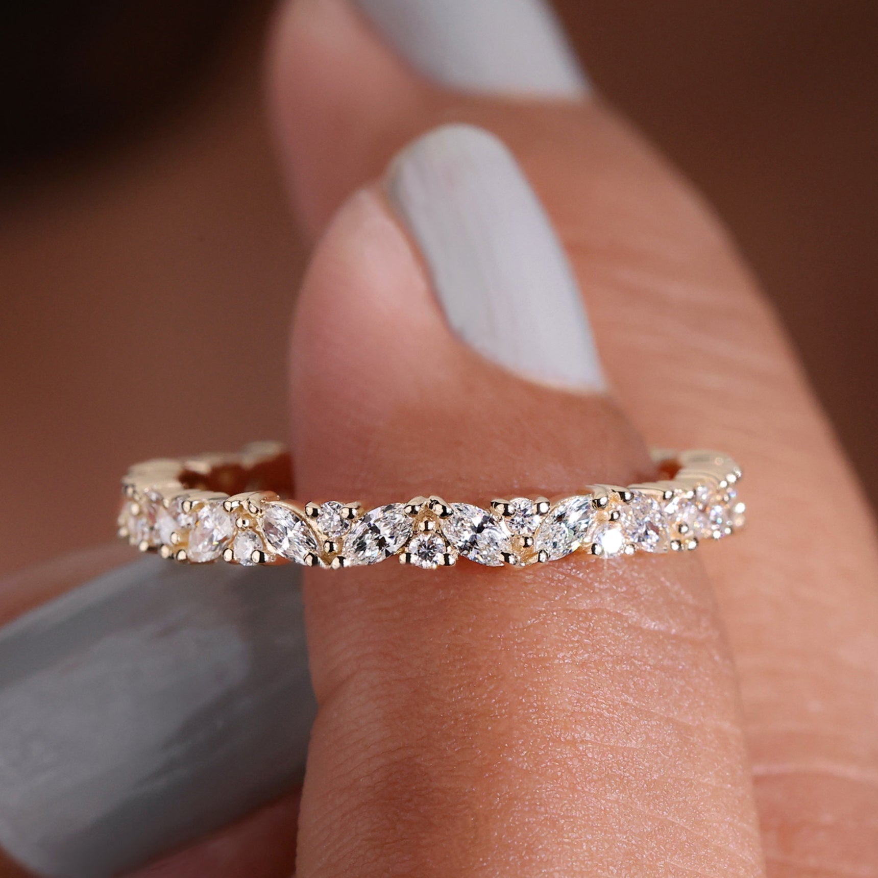 Marquise diamond eternity band with sparkling stones.