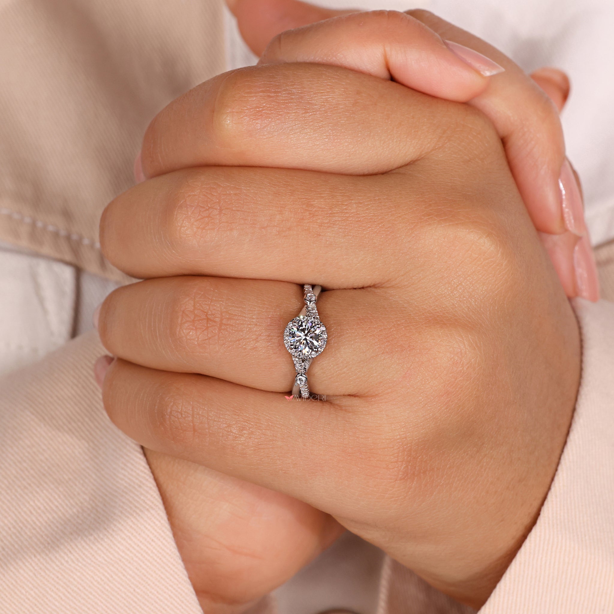 Avideri ring with a halo diamond engagement ring.