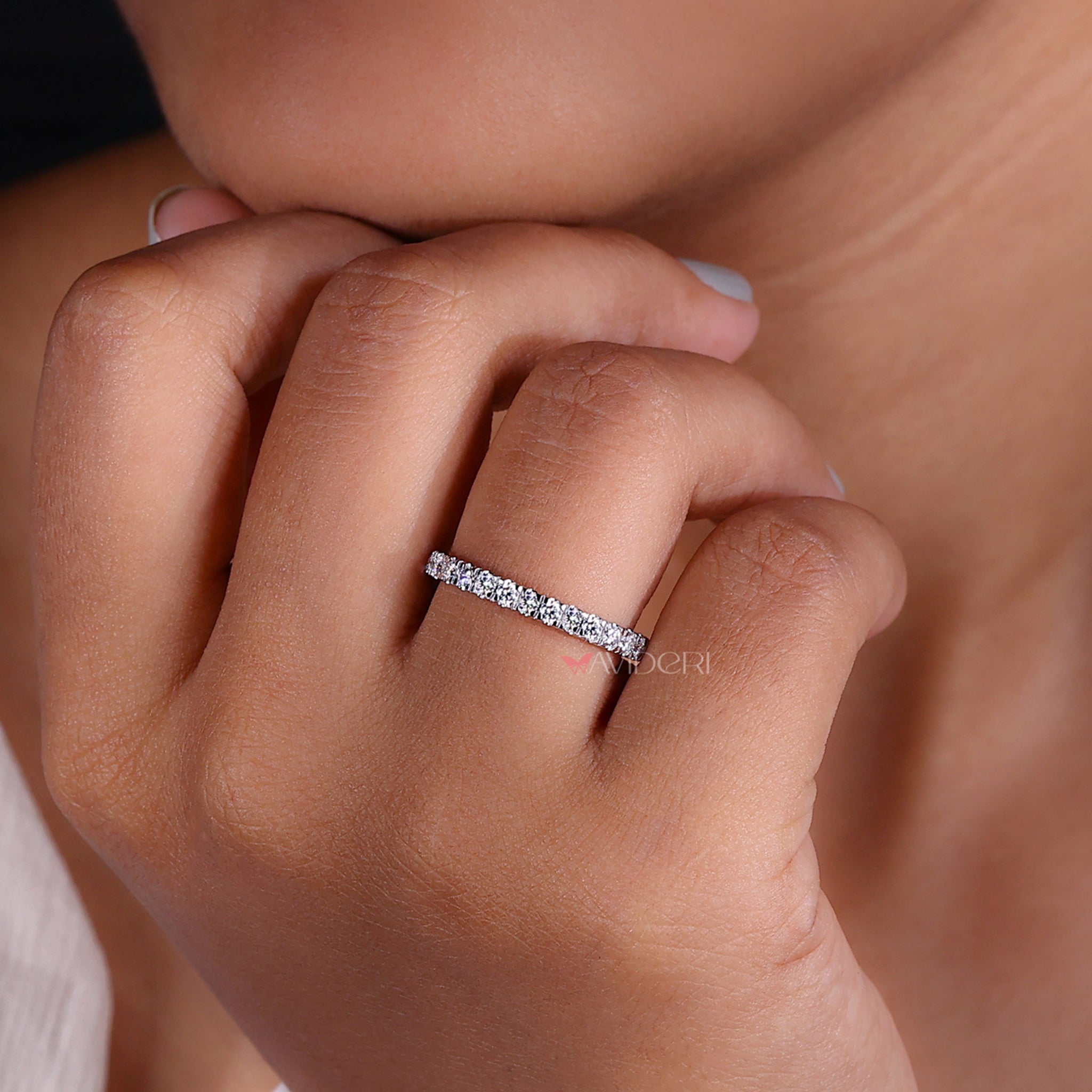 Round diamond wedding band with a refined design.