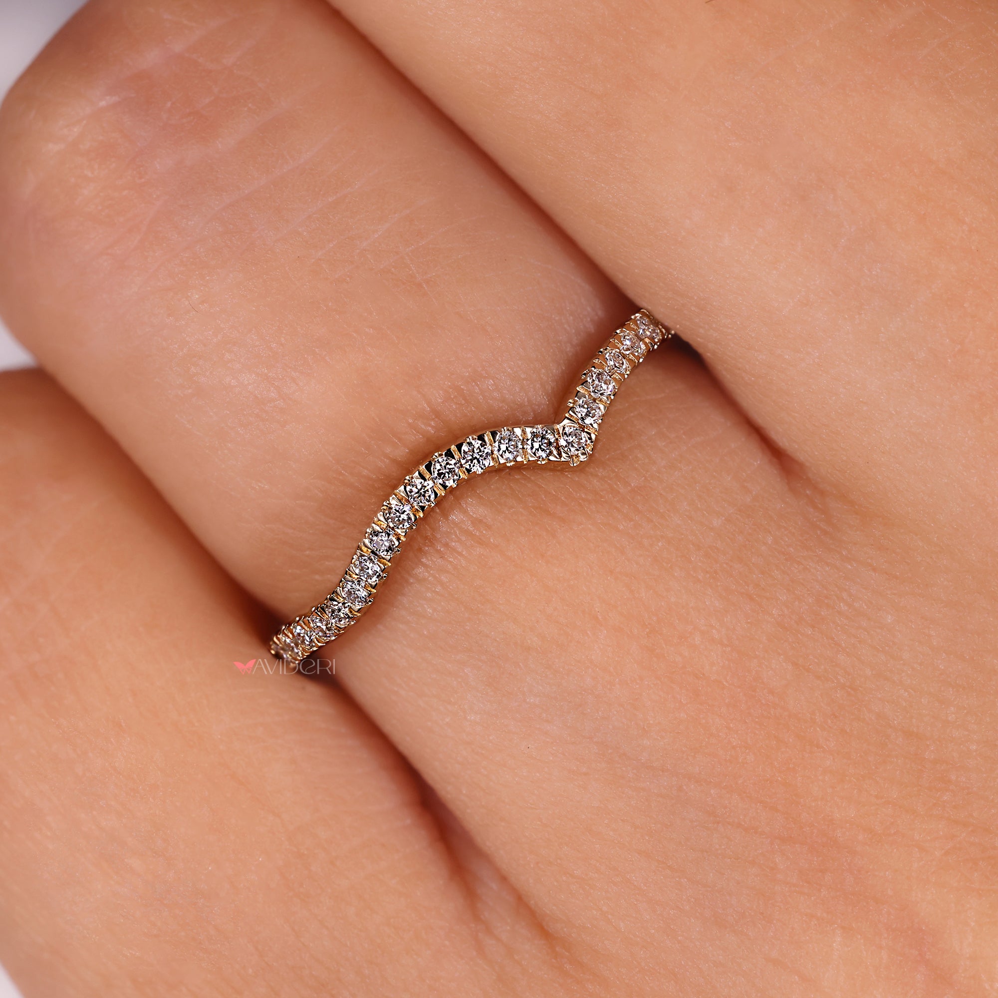 Elegant gold engagement band with a row of diamonds, perfect for a simple and stunning look.