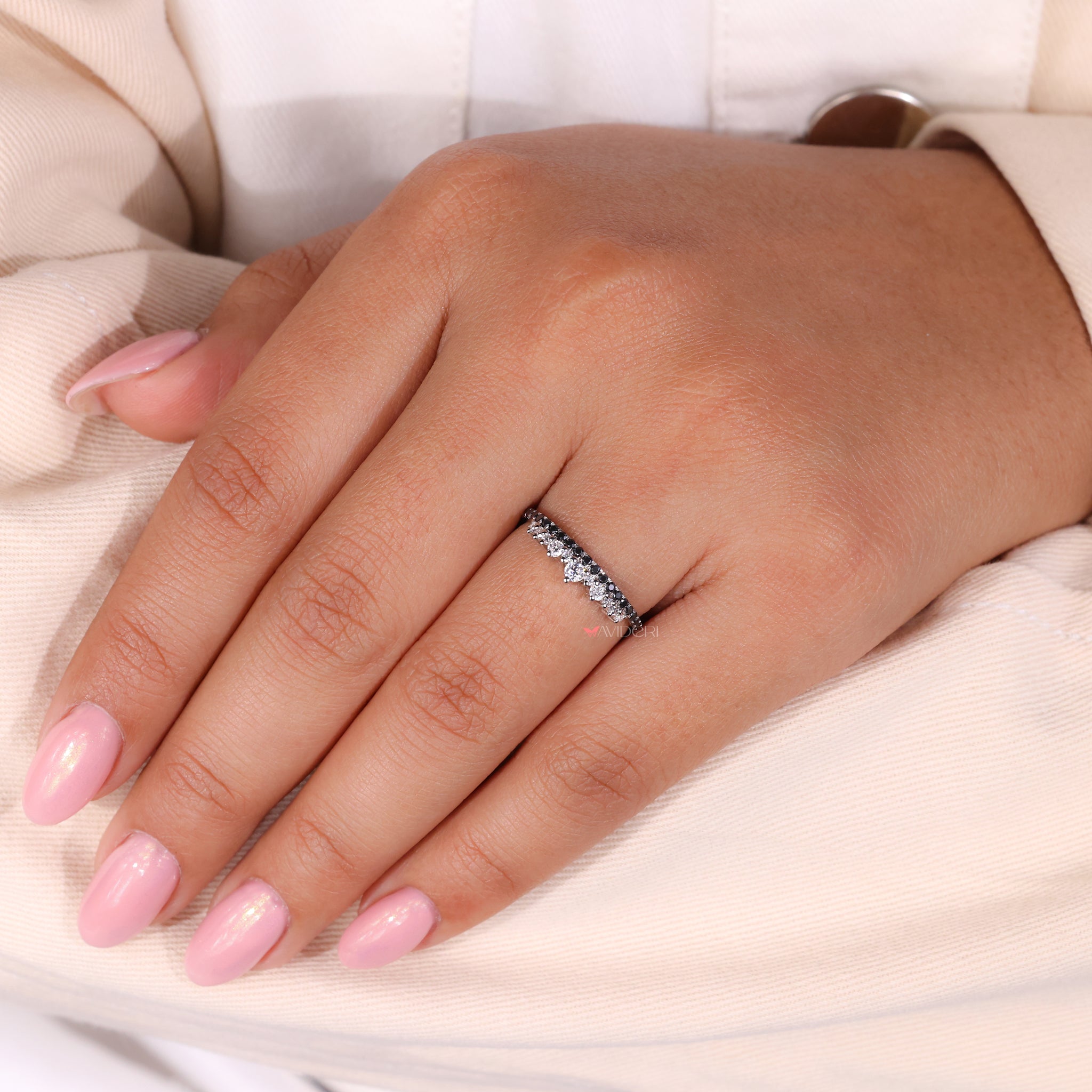 Half eternity wedding band featuring a round wedding band in white gold.