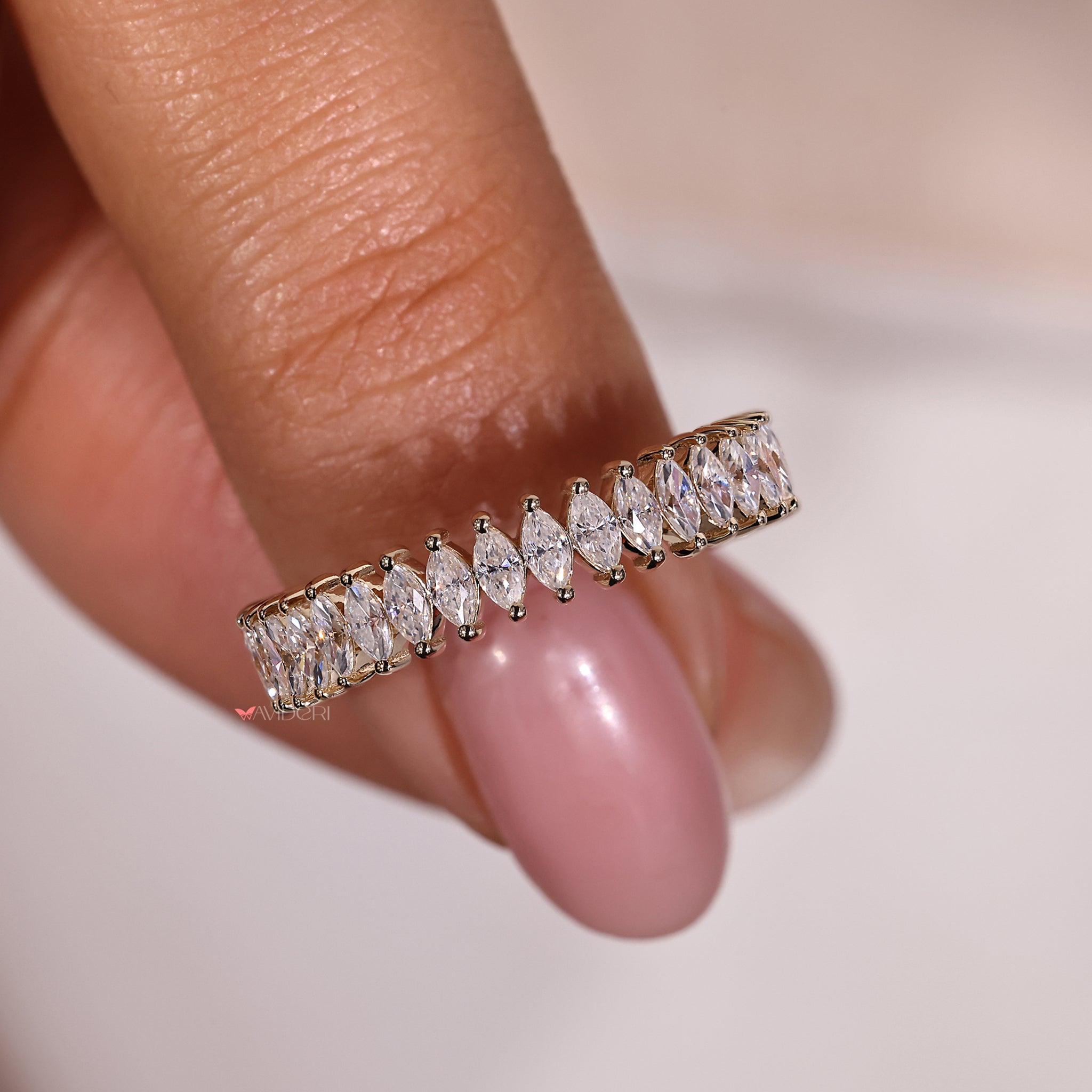 Marquise cut wedding band with unique diamond arrangement.